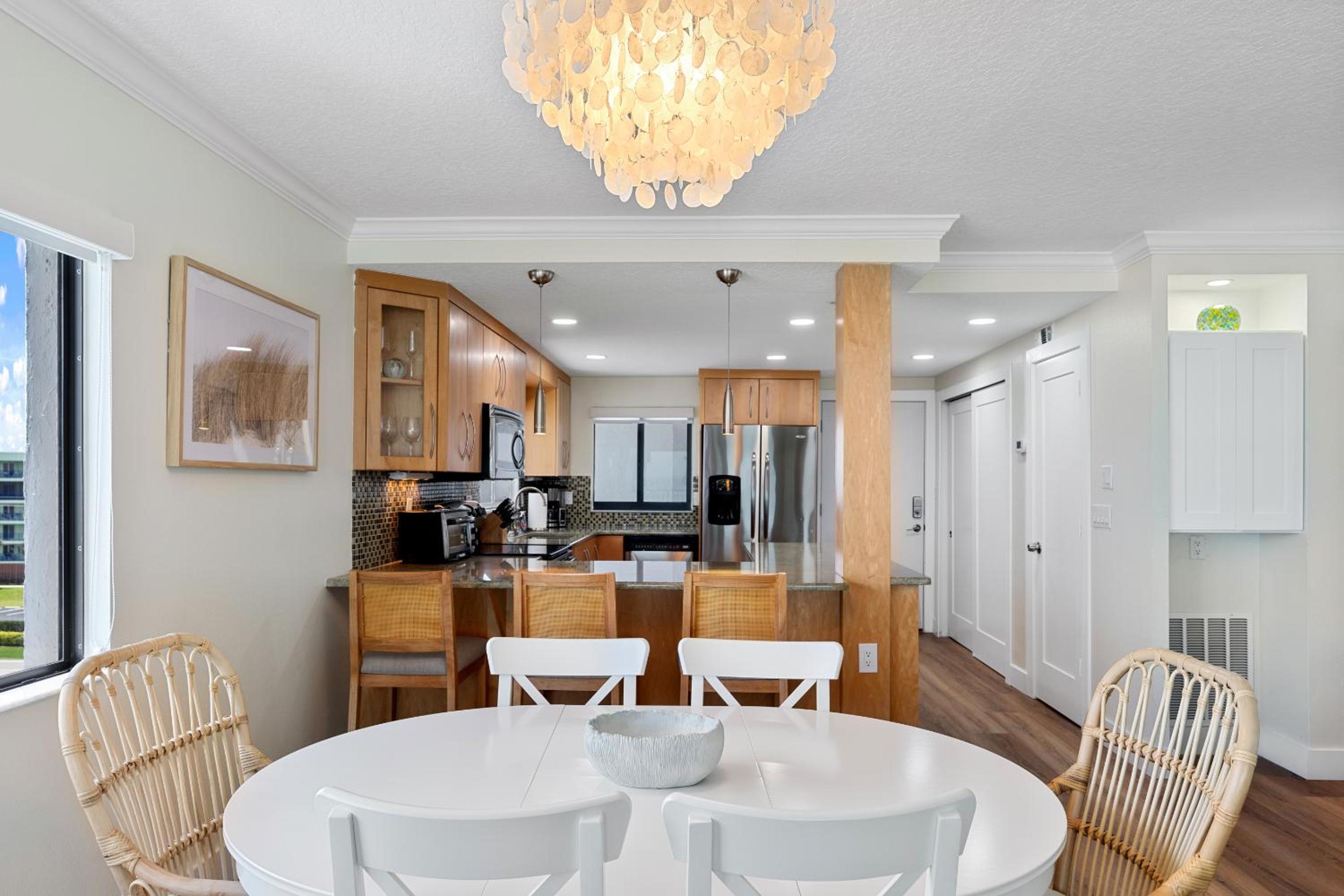 Updated direct oceanfront corner condo with large wrap-around balcony and heated pool