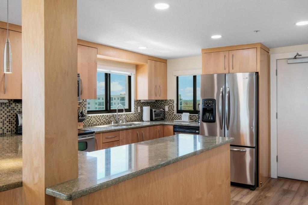 Updated direct oceanfront corner condo with large wrap-around balcony and heated pool