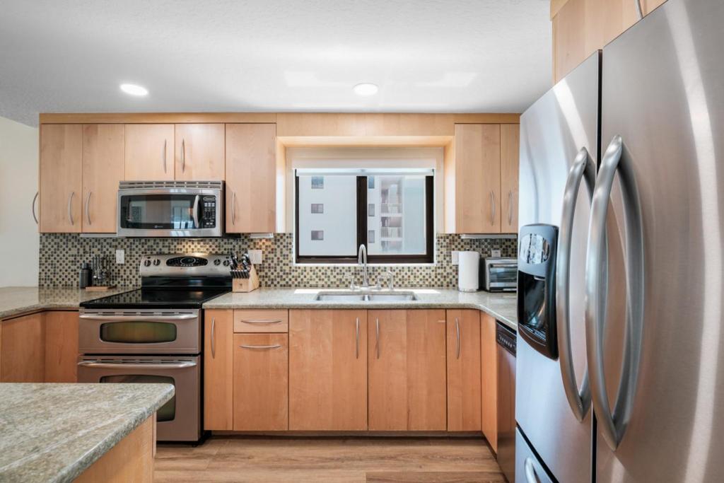 Updated direct oceanfront corner condo with large wrap-around balcony and heated pool