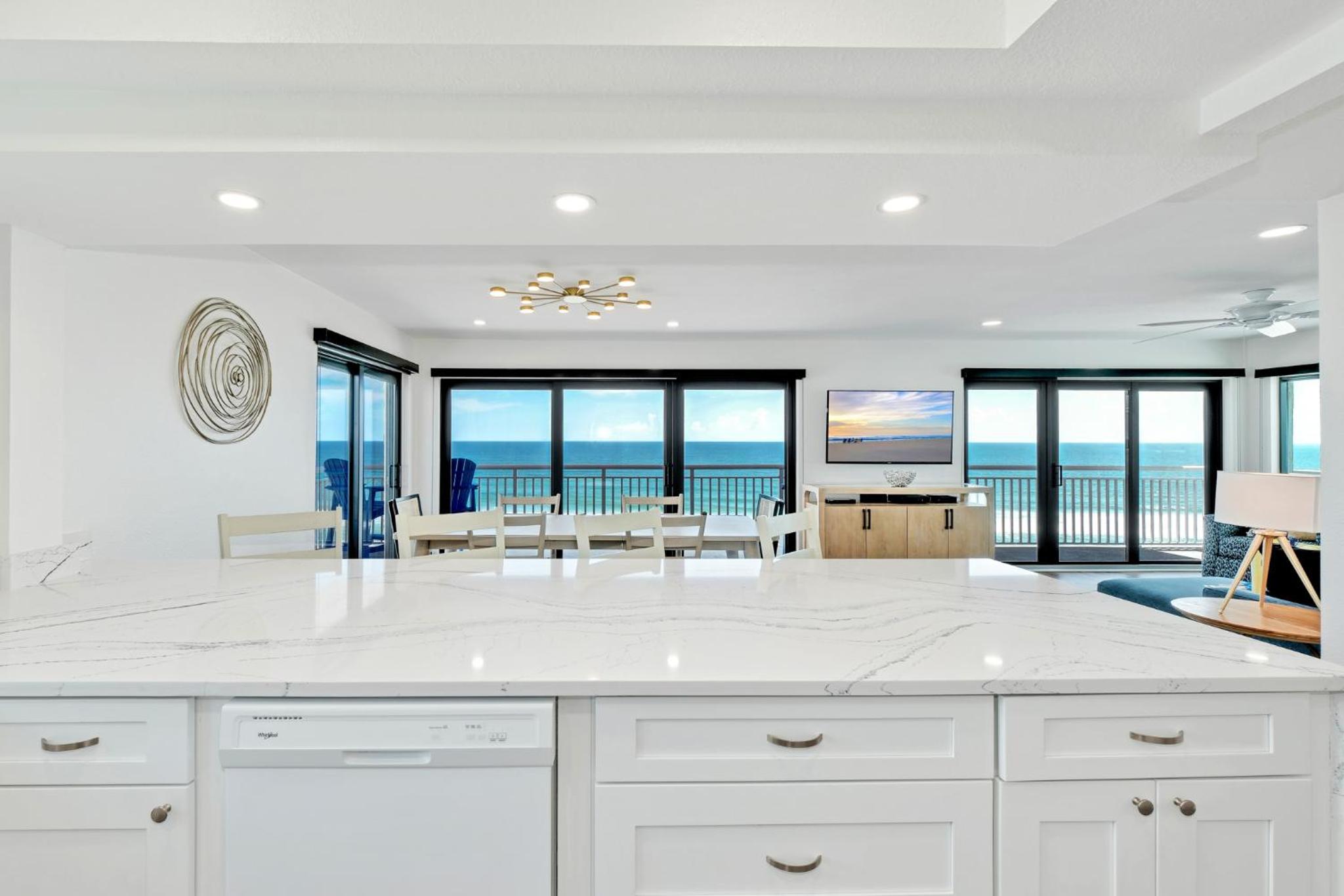 Direct oceanfront corner penthouse with huge wrap-around balcony offering beach and pool views