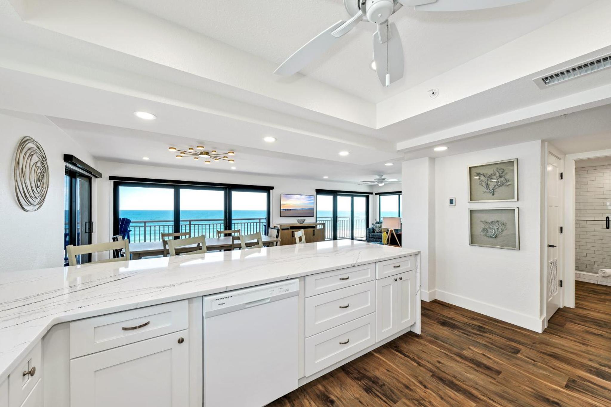 Direct oceanfront corner penthouse with huge wrap-around balcony offering beach and pool views