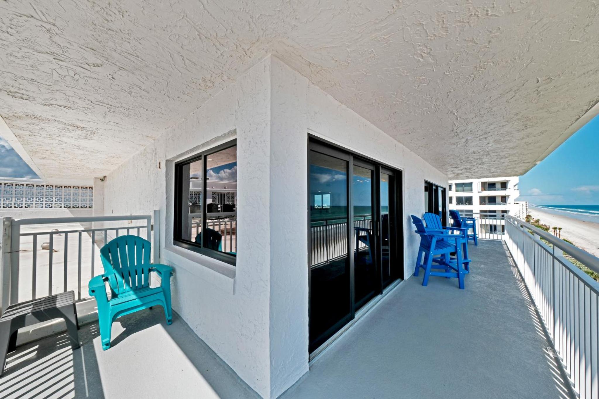 Direct oceanfront corner penthouse with huge wrap-around balcony offering beach and pool views