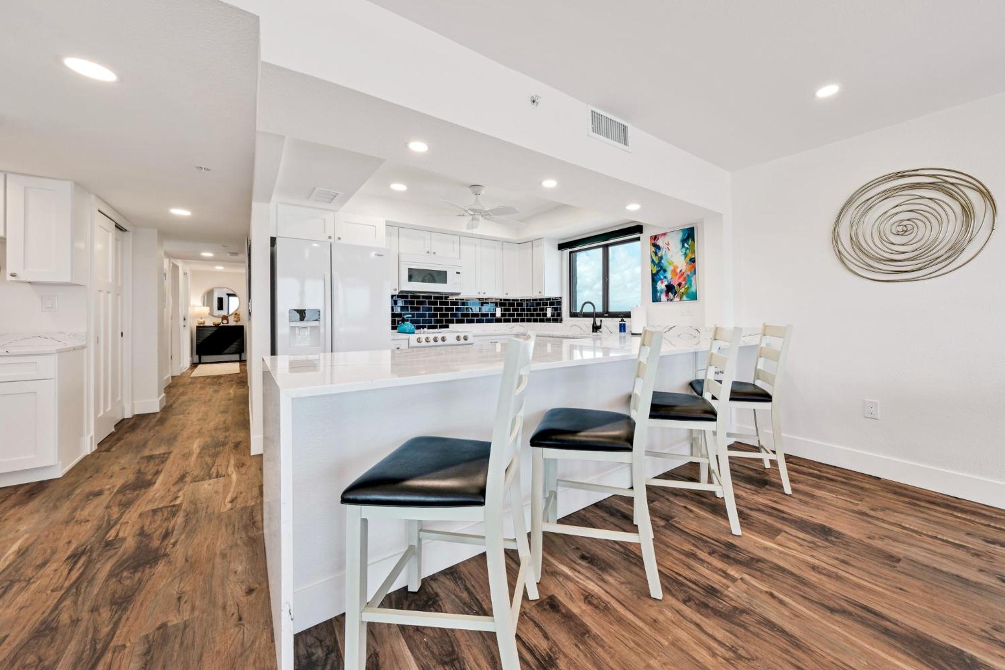 Direct oceanfront corner penthouse with huge wrap-around balcony offering beach and pool views