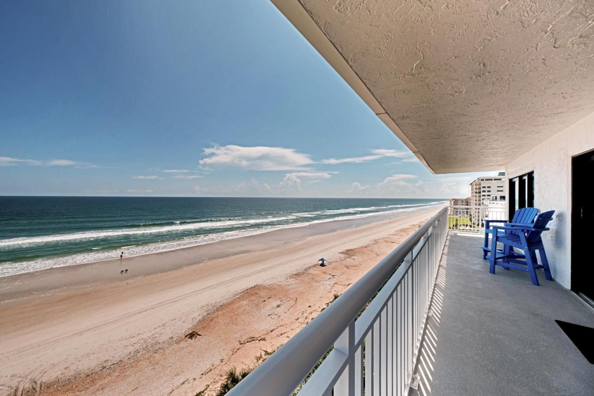 Direct oceanfront corner penthouse with huge wrap-around balcony offering beach and pool views