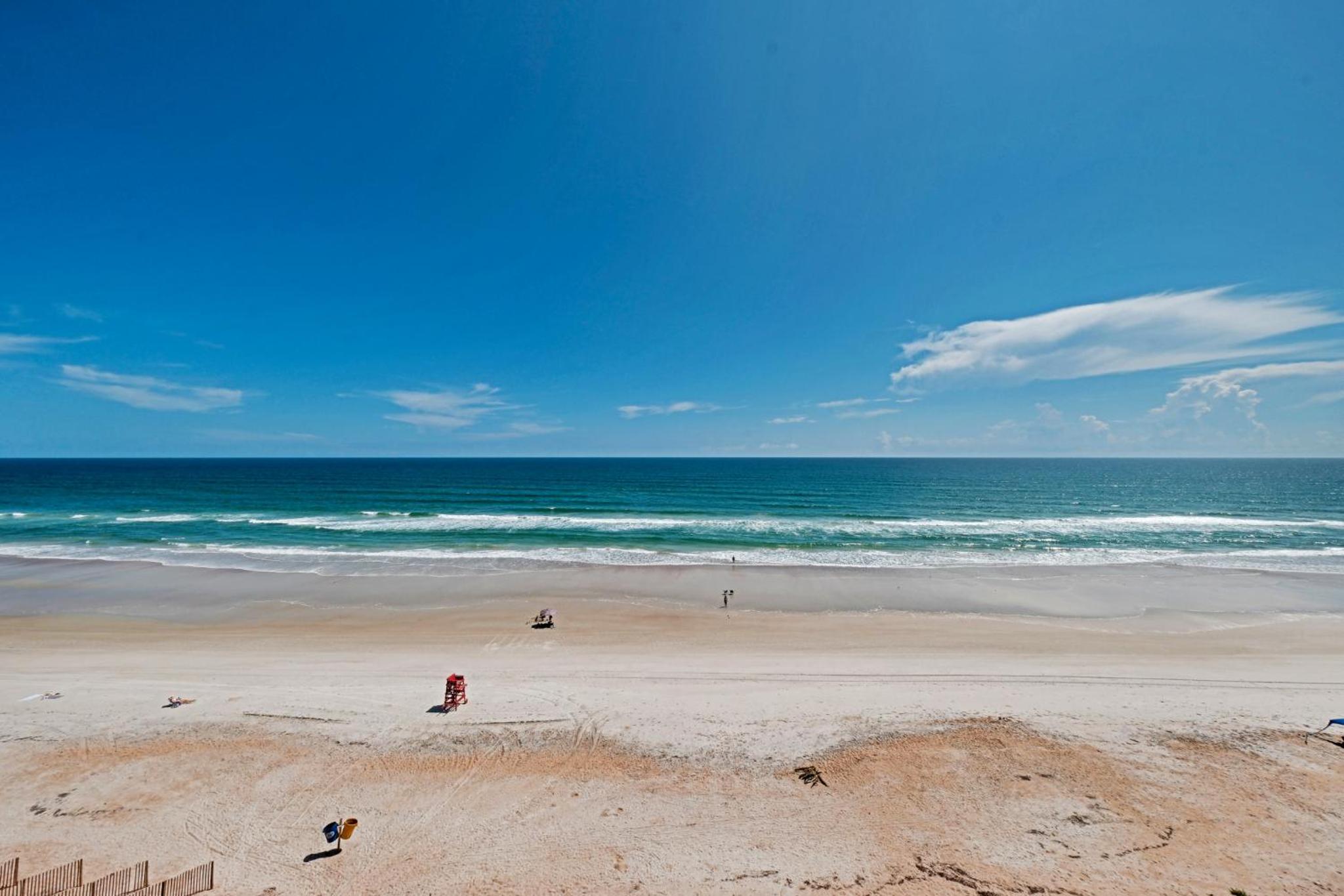 Direct oceanfront corner penthouse with huge wrap-around balcony offering beach and pool views
