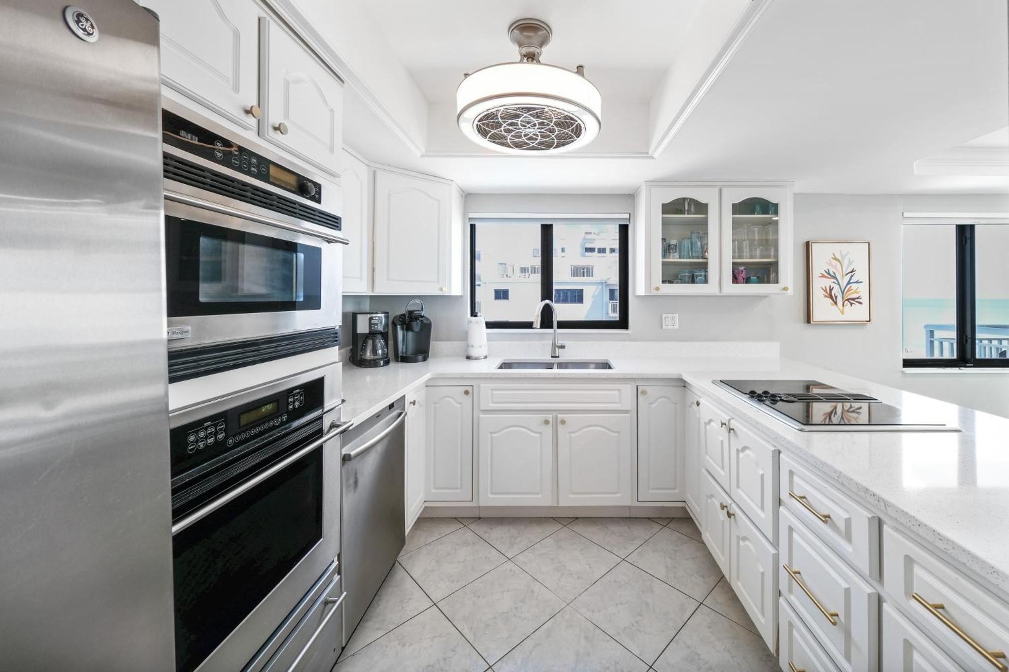 Updated direct oceanfront corner condo with a wrap-around balcony overlooking the heated pool
