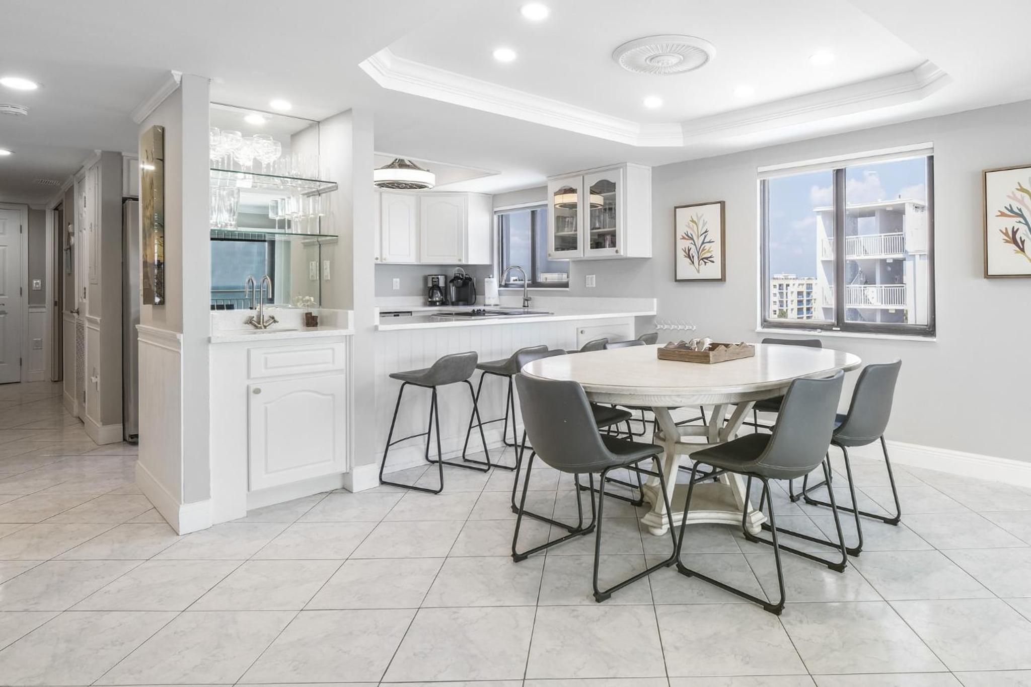 Updated direct oceanfront corner condo with a wrap-around balcony overlooking the heated pool
