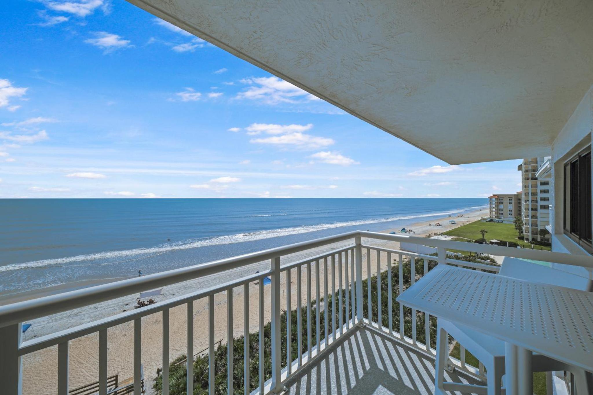 Updated direct oceanfront corner condo with a wrap-around balcony overlooking the heated pool