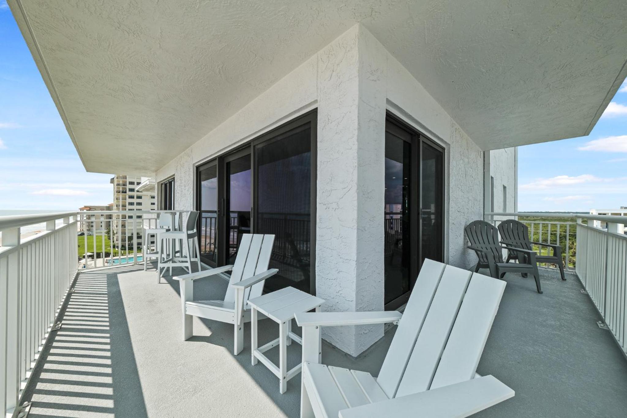 Updated direct oceanfront corner condo with a wrap-around balcony overlooking the heated pool