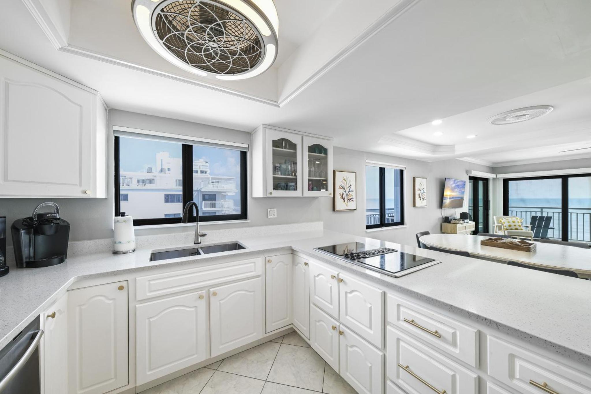 Updated direct oceanfront corner condo with a wrap-around balcony overlooking the heated pool