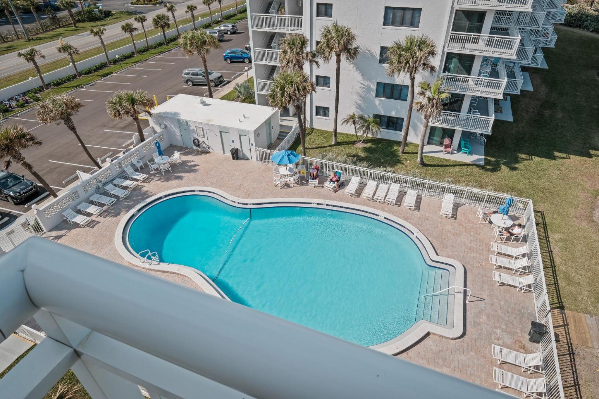 Updated direct oceanfront corner condo with a wrap-around balcony overlooking the heated pool