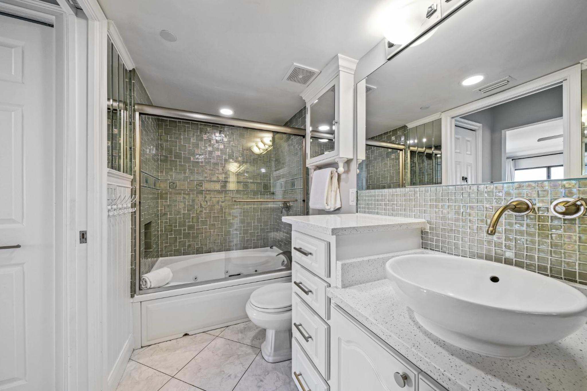 Updated direct oceanfront corner condo with a wrap-around balcony overlooking the heated pool