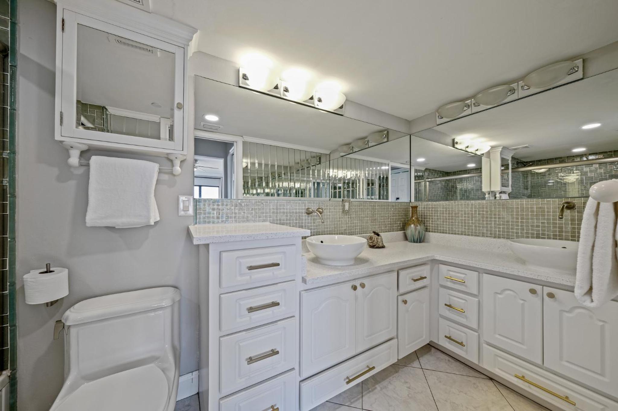 Updated direct oceanfront corner condo with a wrap-around balcony overlooking the heated pool