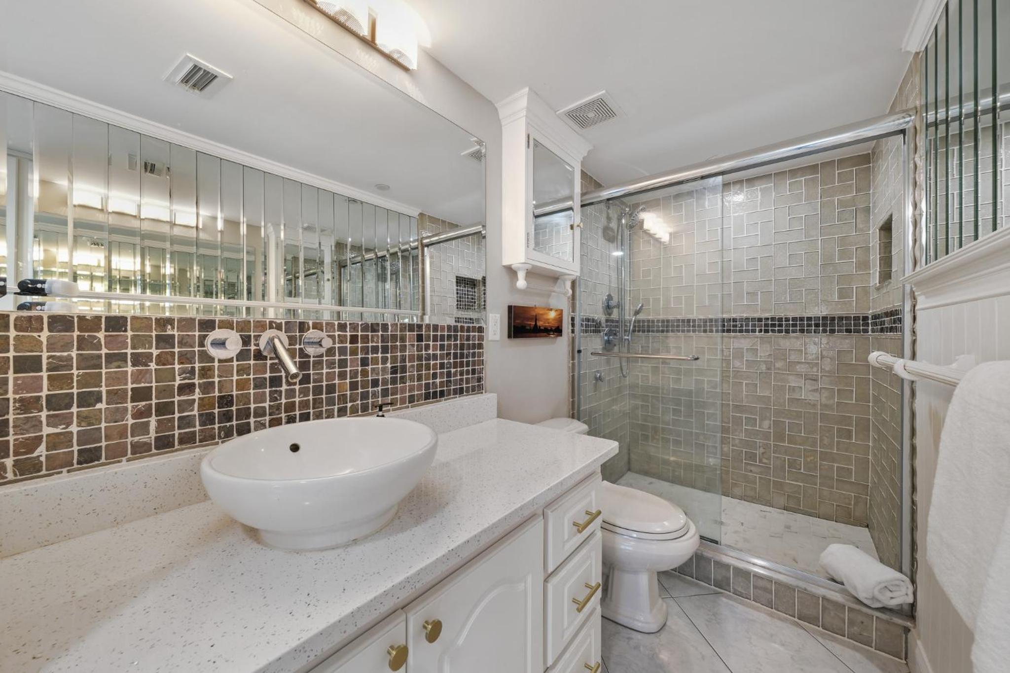 Updated direct oceanfront corner condo with a wrap-around balcony overlooking the heated pool