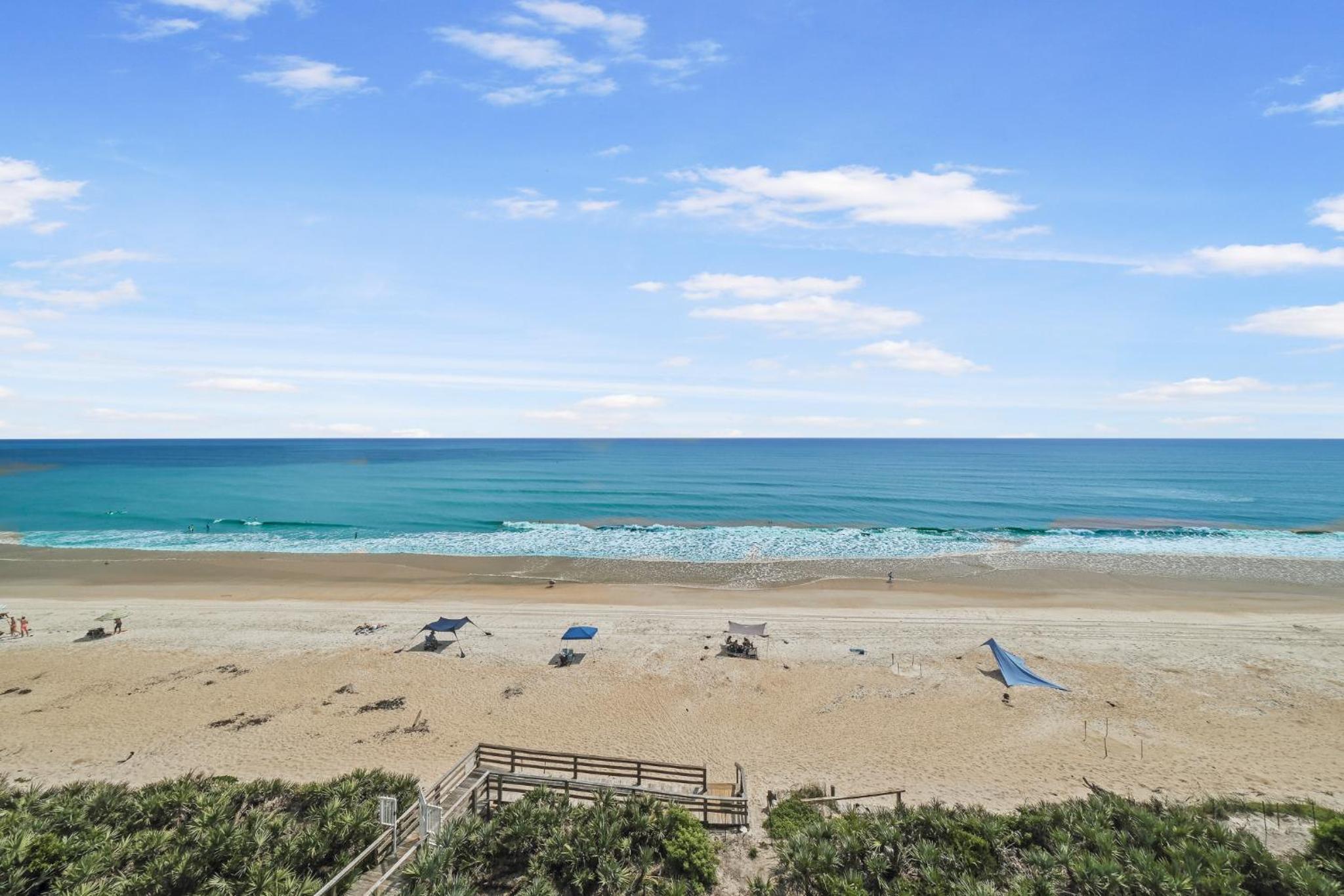Updated direct oceanfront corner condo with a wrap-around balcony overlooking the heated pool