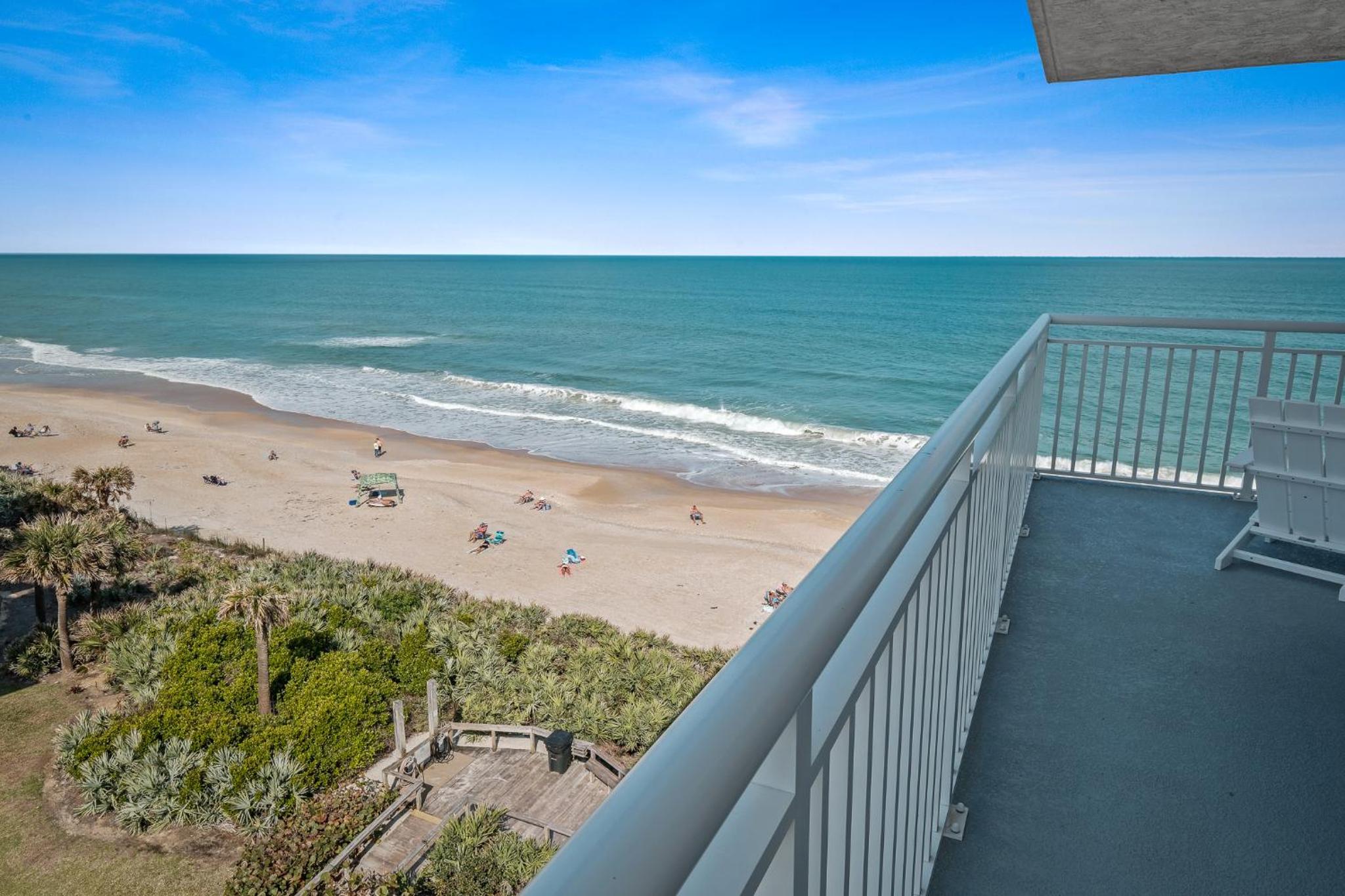 Updated direct oceanfront corner condo with a wrap-around balcony overlooking the heated pool