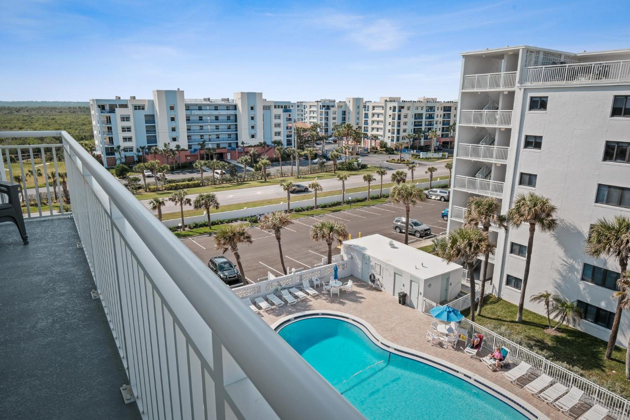Updated direct oceanfront corner condo with a wrap-around balcony overlooking the heated pool