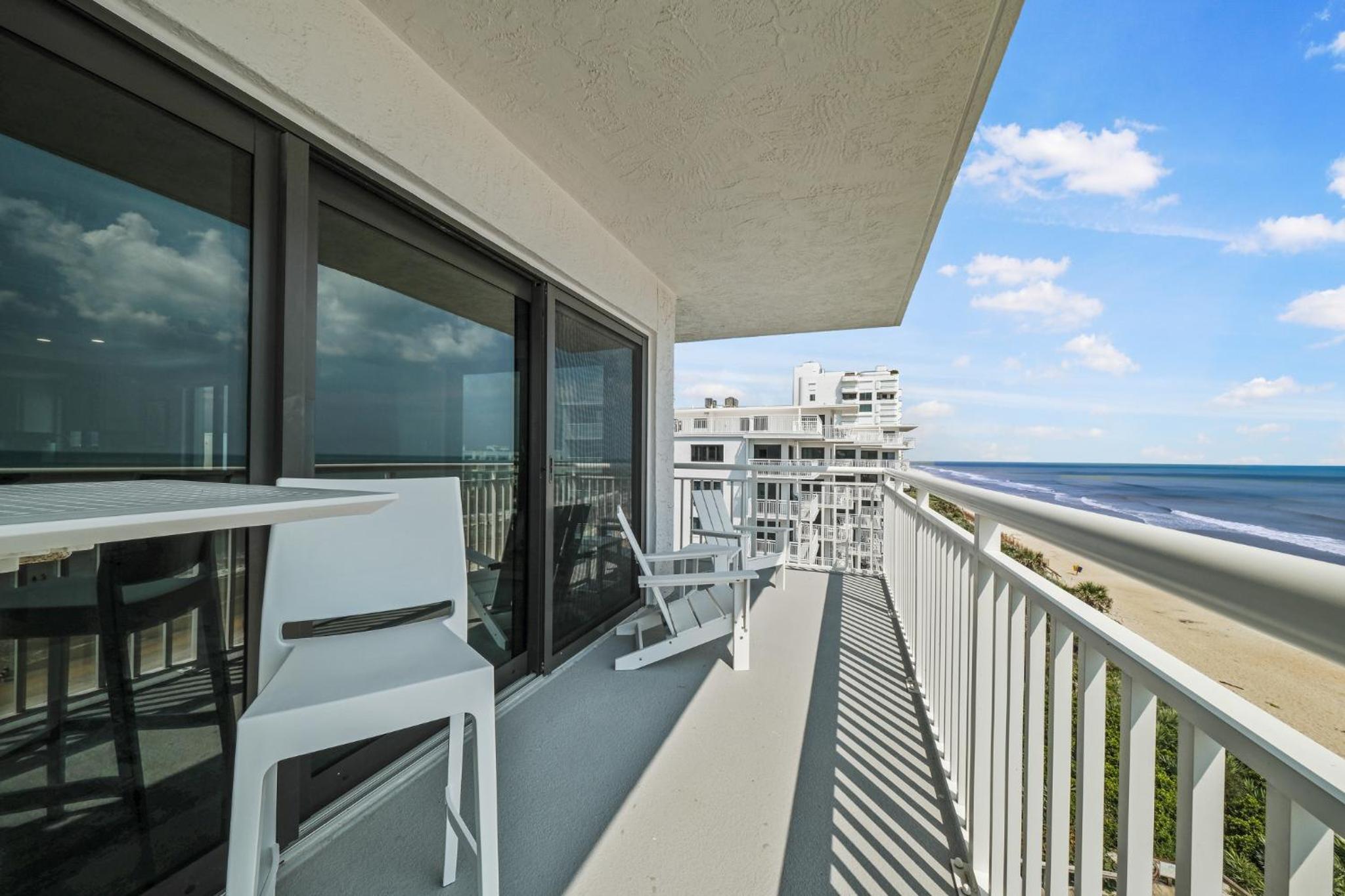 Updated direct oceanfront corner condo with a wrap-around balcony overlooking the heated pool
