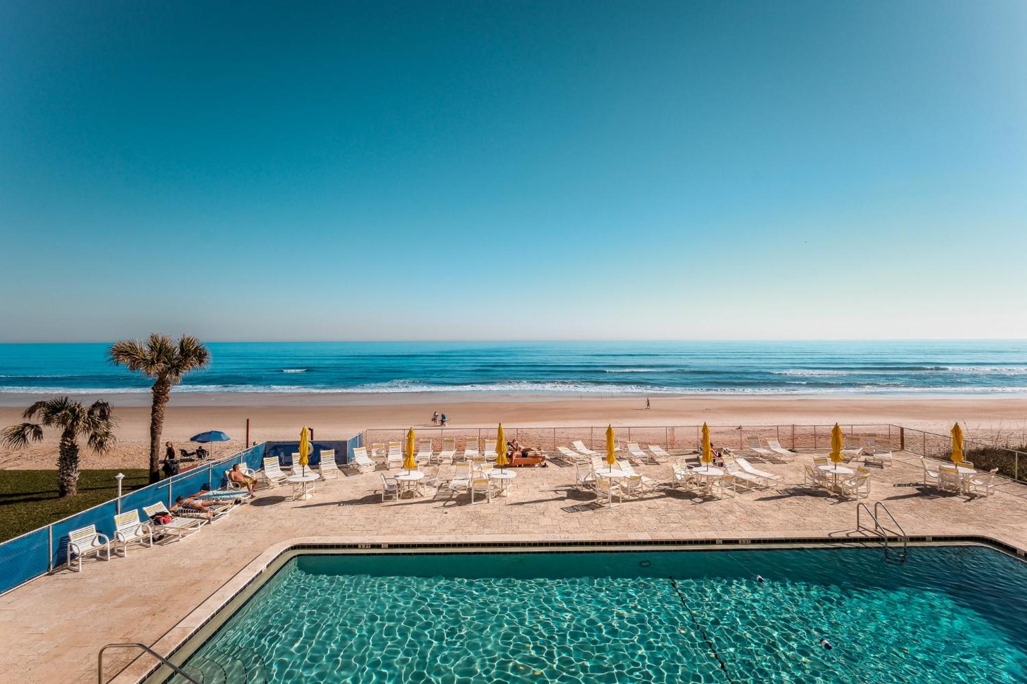 New listing! Direct oceanfront condo with a balcony, heated pool, and tennis court