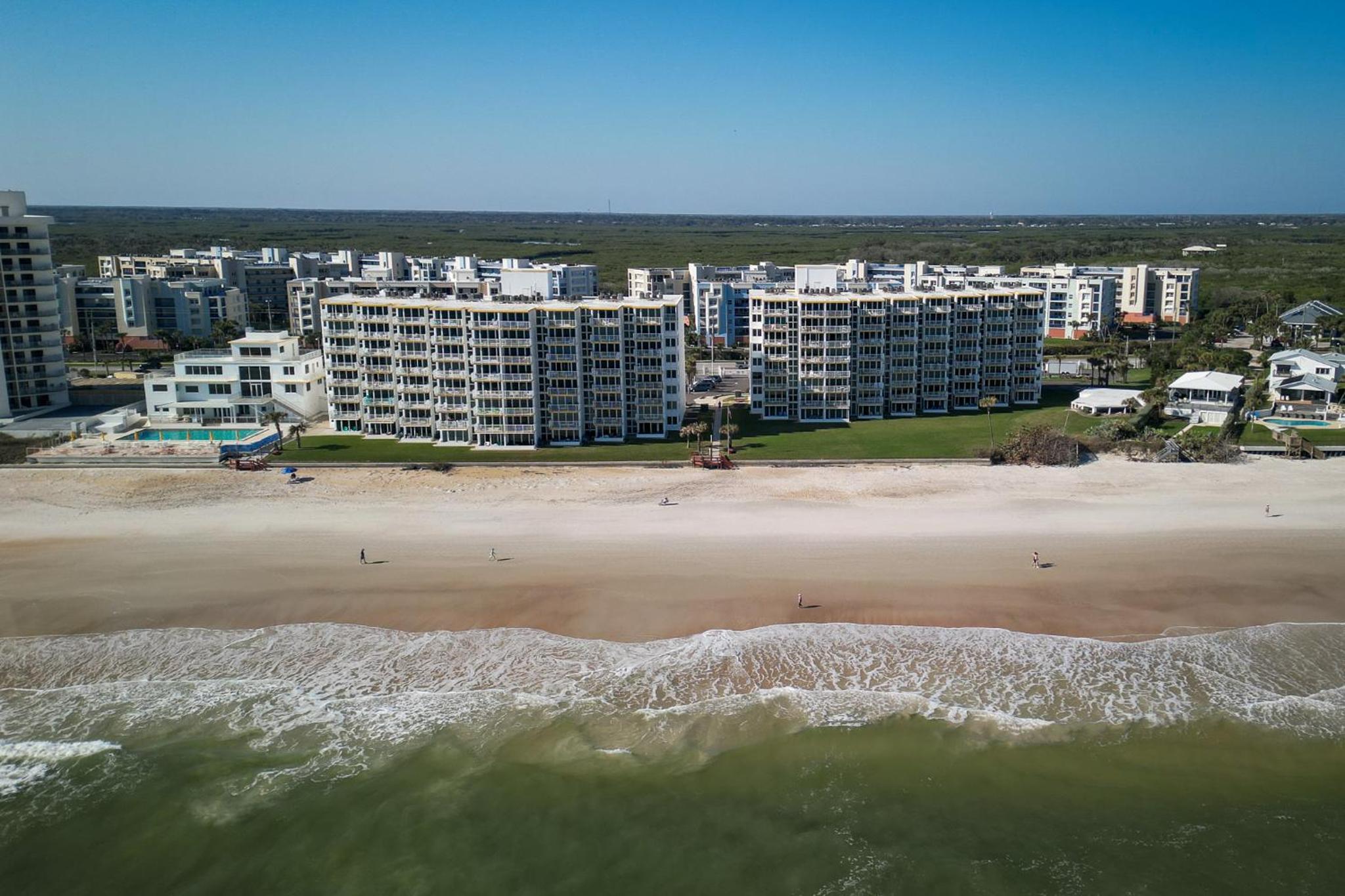New listing! Direct oceanfront condo with a balcony, heated pool, and tennis court