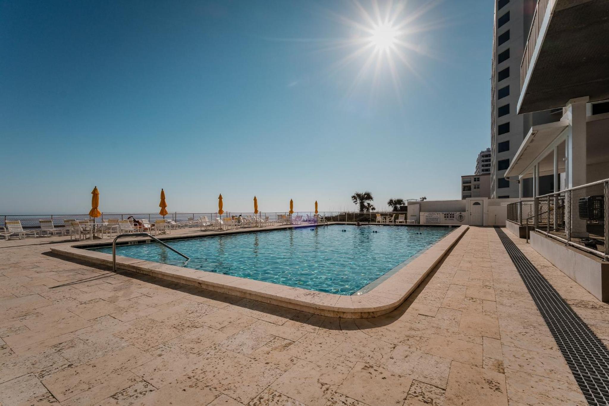 New listing! Direct oceanfront condo with a balcony, heated pool, and tennis court