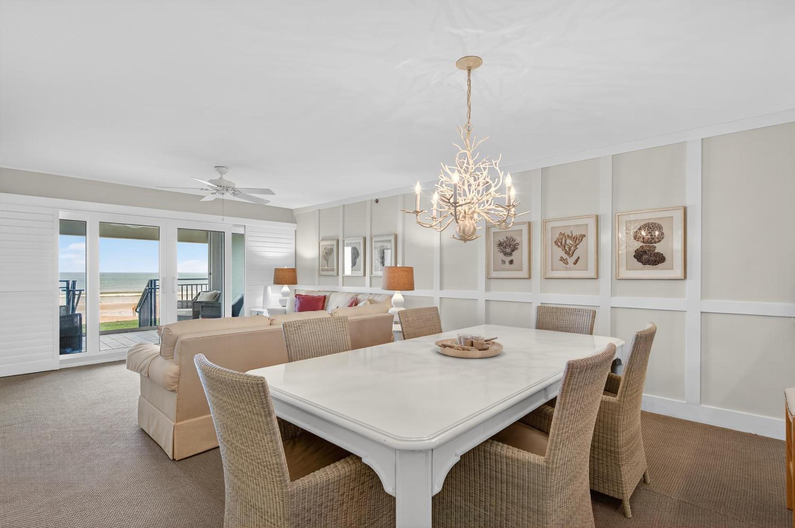 Ground floor direct oceanfront with a large patio, pool, and covered parking