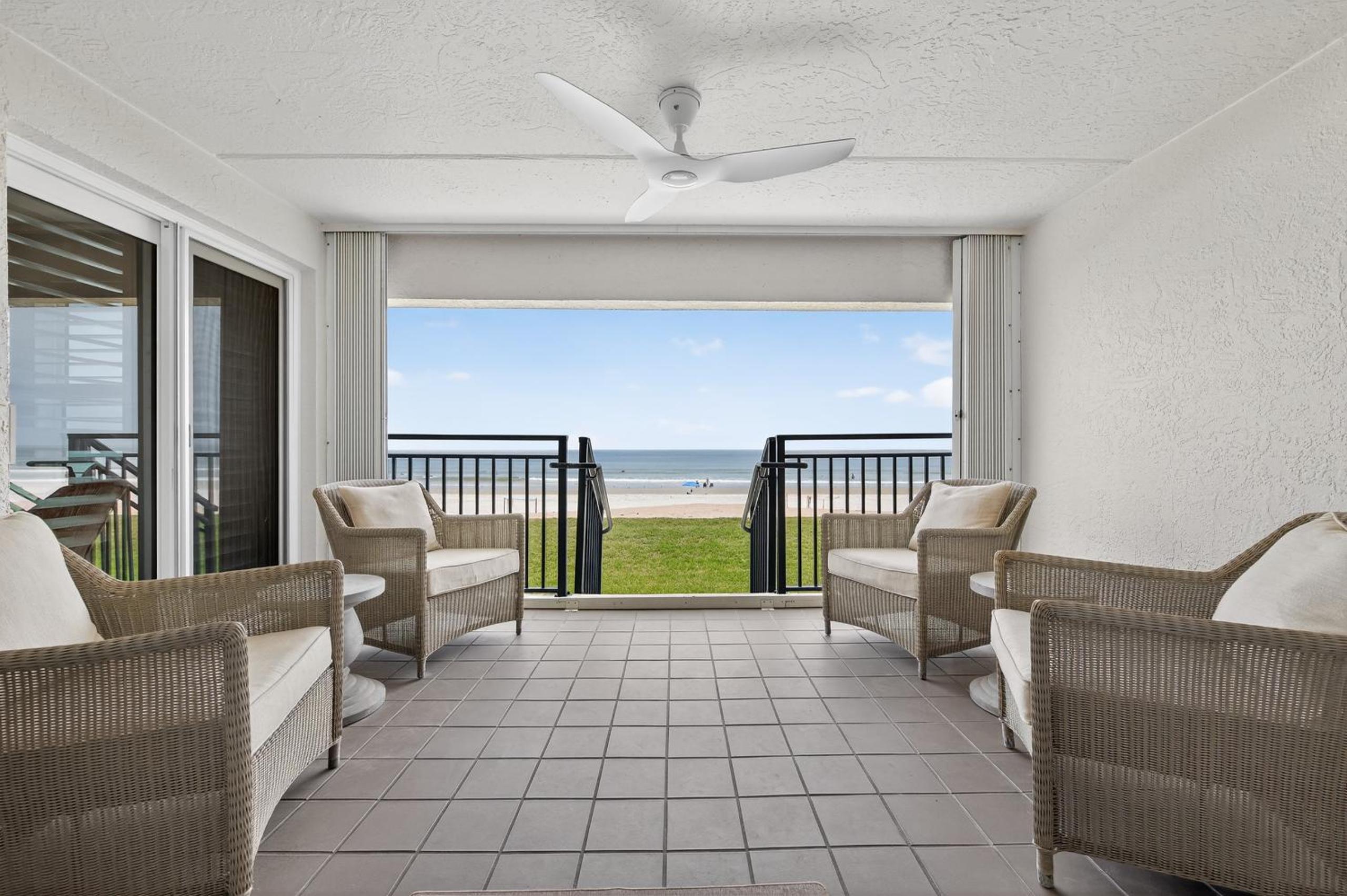 Ground floor direct oceanfront with a large patio, pool, and covered parking