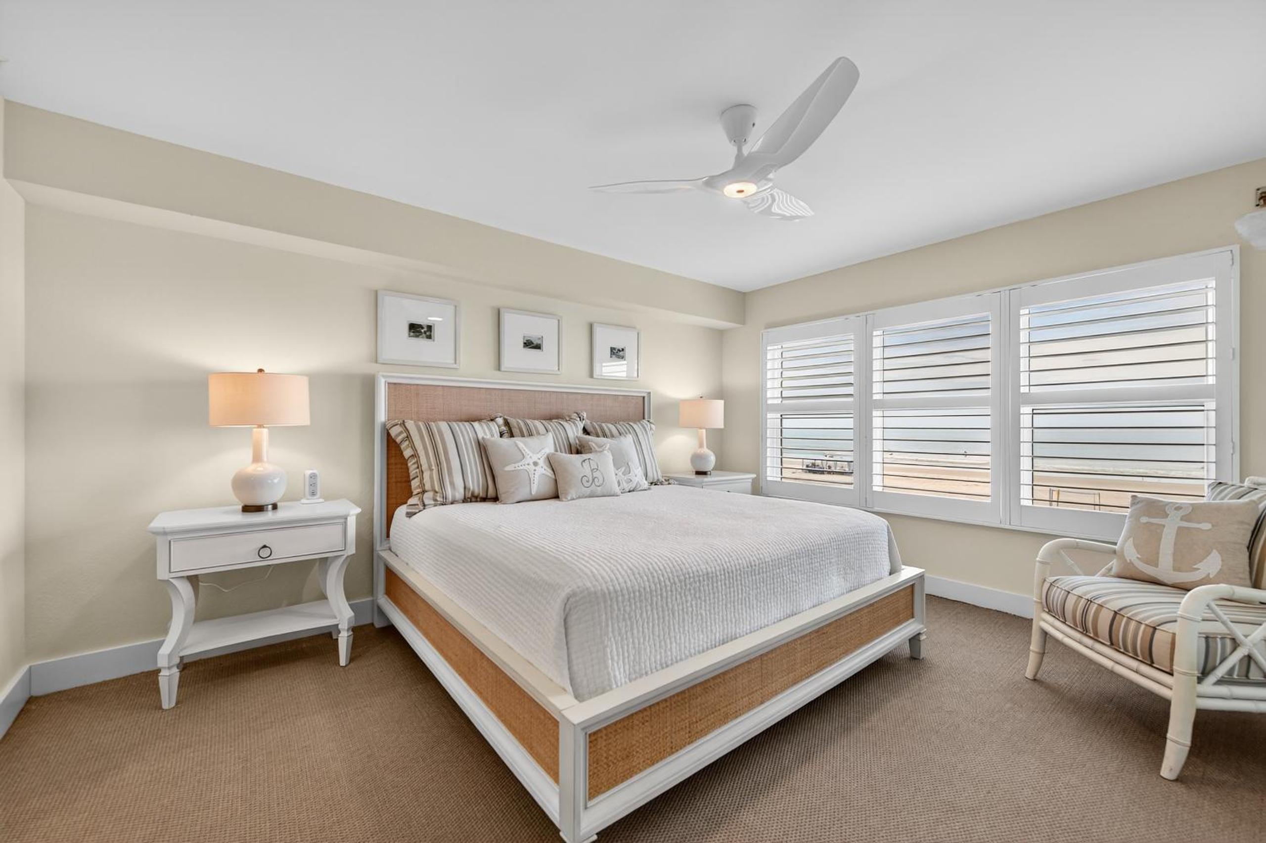 Ground floor direct oceanfront with a large patio, pool, and covered parking