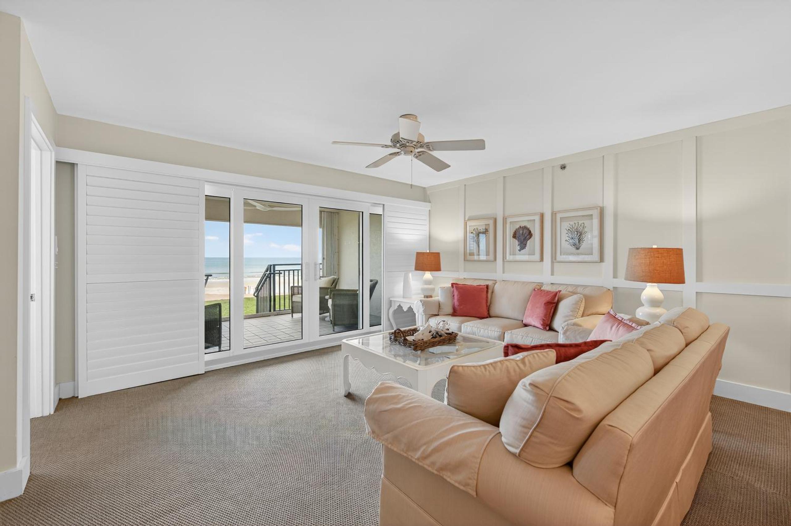 Ground floor direct oceanfront with a large patio, pool, and covered parking