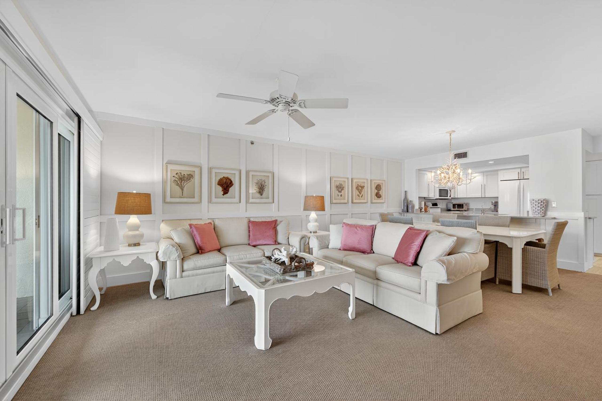 Ground floor direct oceanfront with a large patio, pool, and covered parking