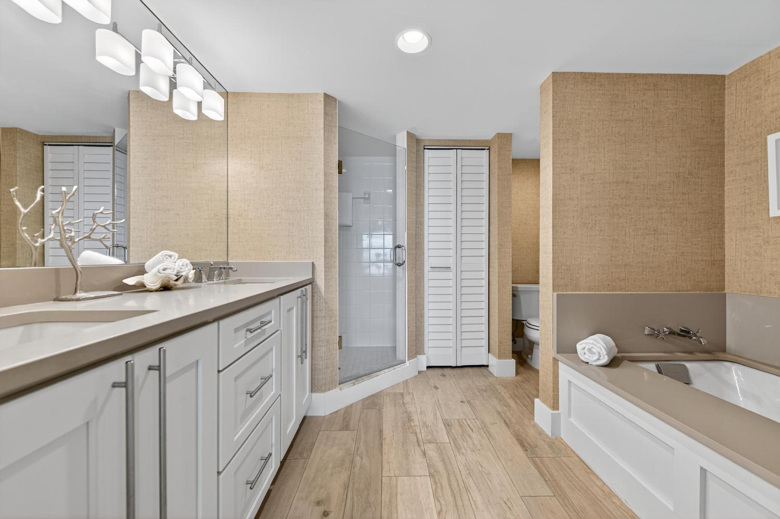 Ground floor direct oceanfront with a large patio, pool, and covered parking