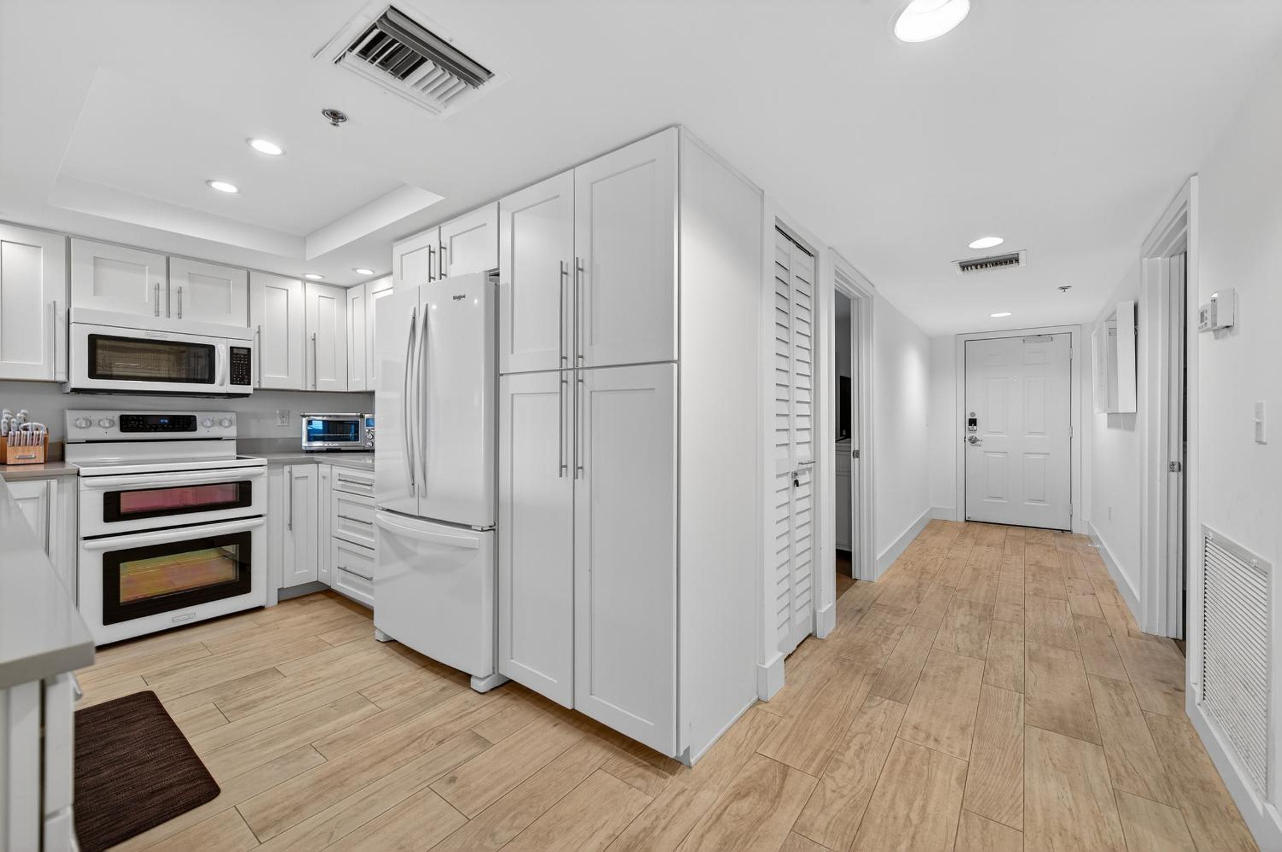 Ground floor direct oceanfront with a large patio, pool, and covered parking
