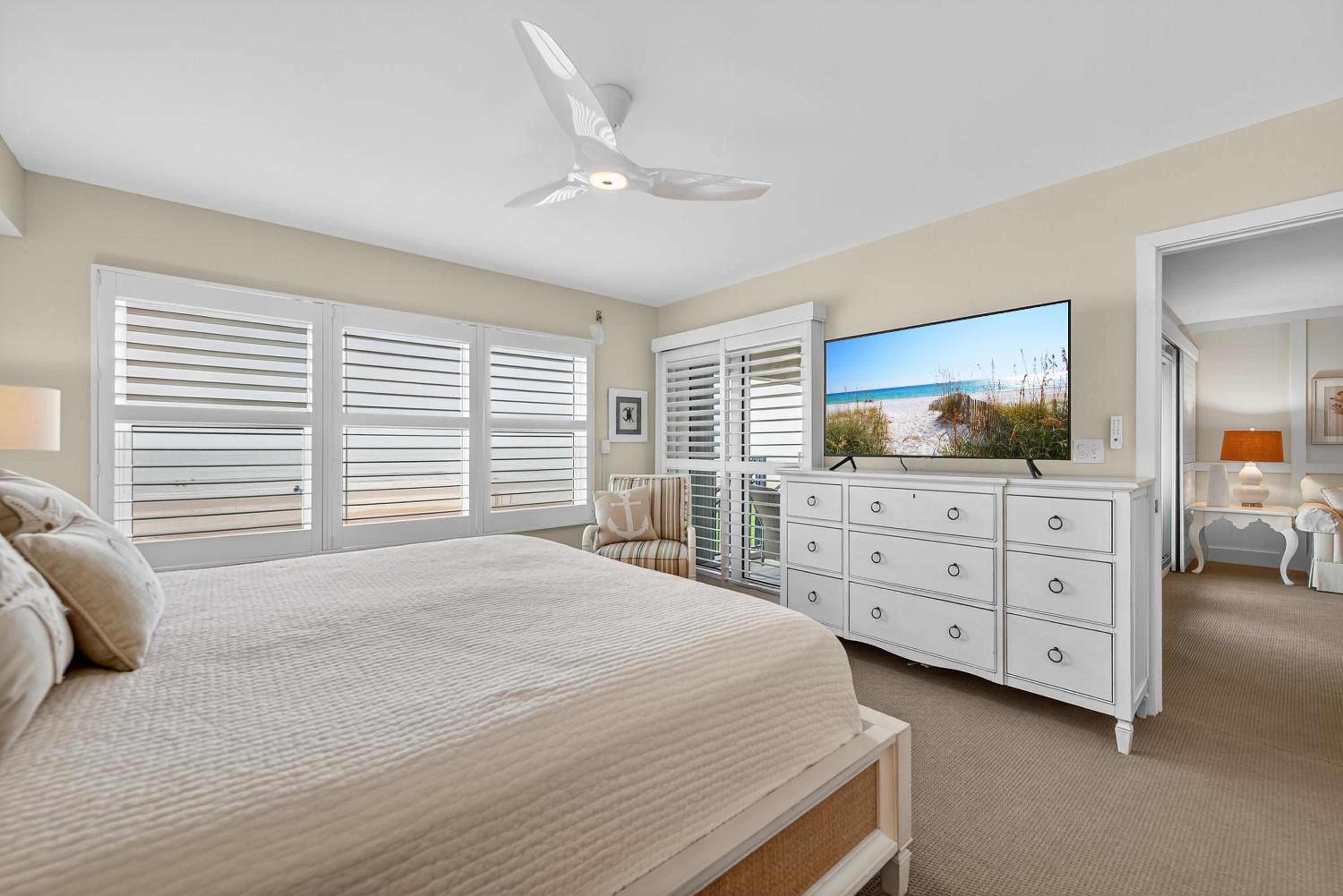 Ground floor direct oceanfront with a large patio, pool, and covered parking