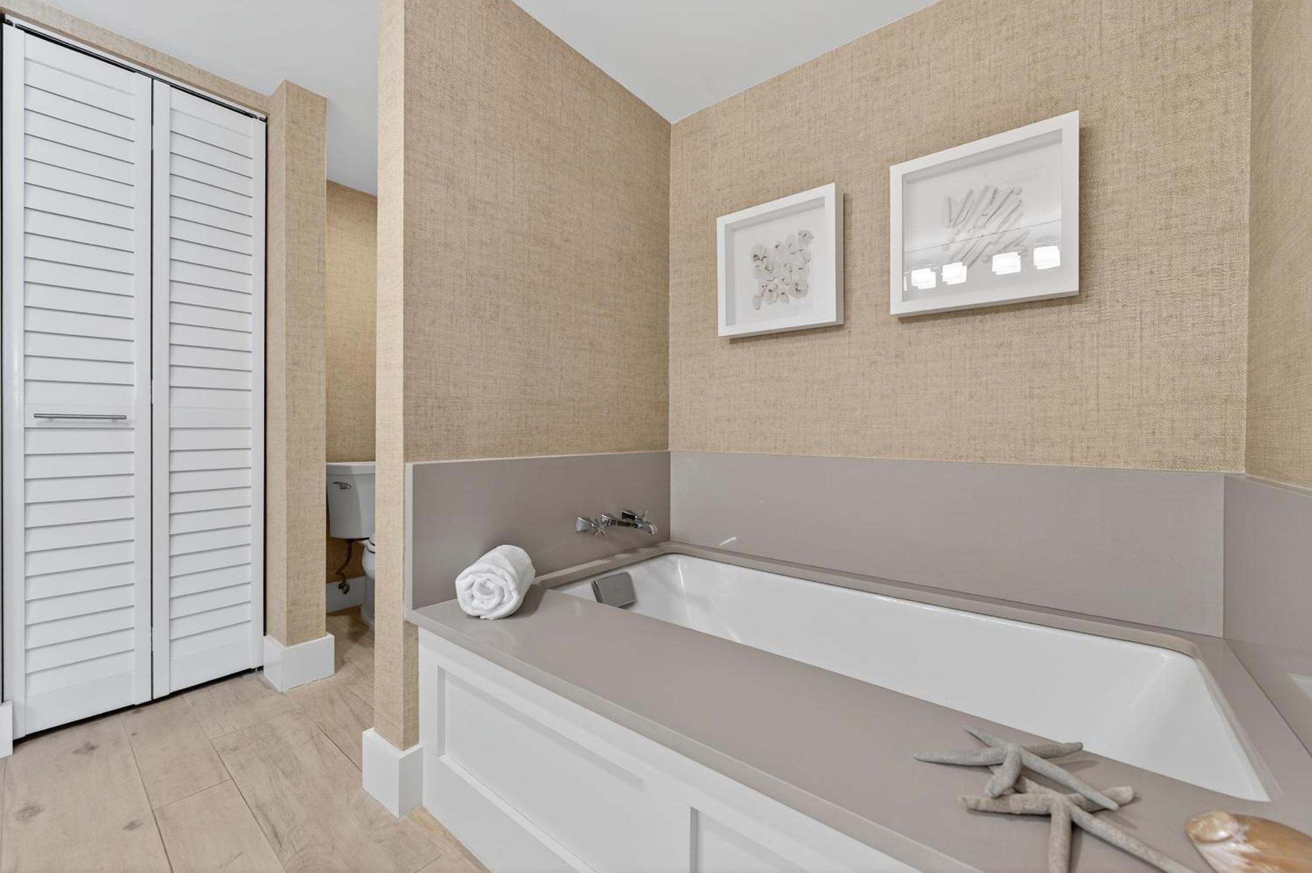 Ground floor direct oceanfront with a large patio, pool, and covered parking