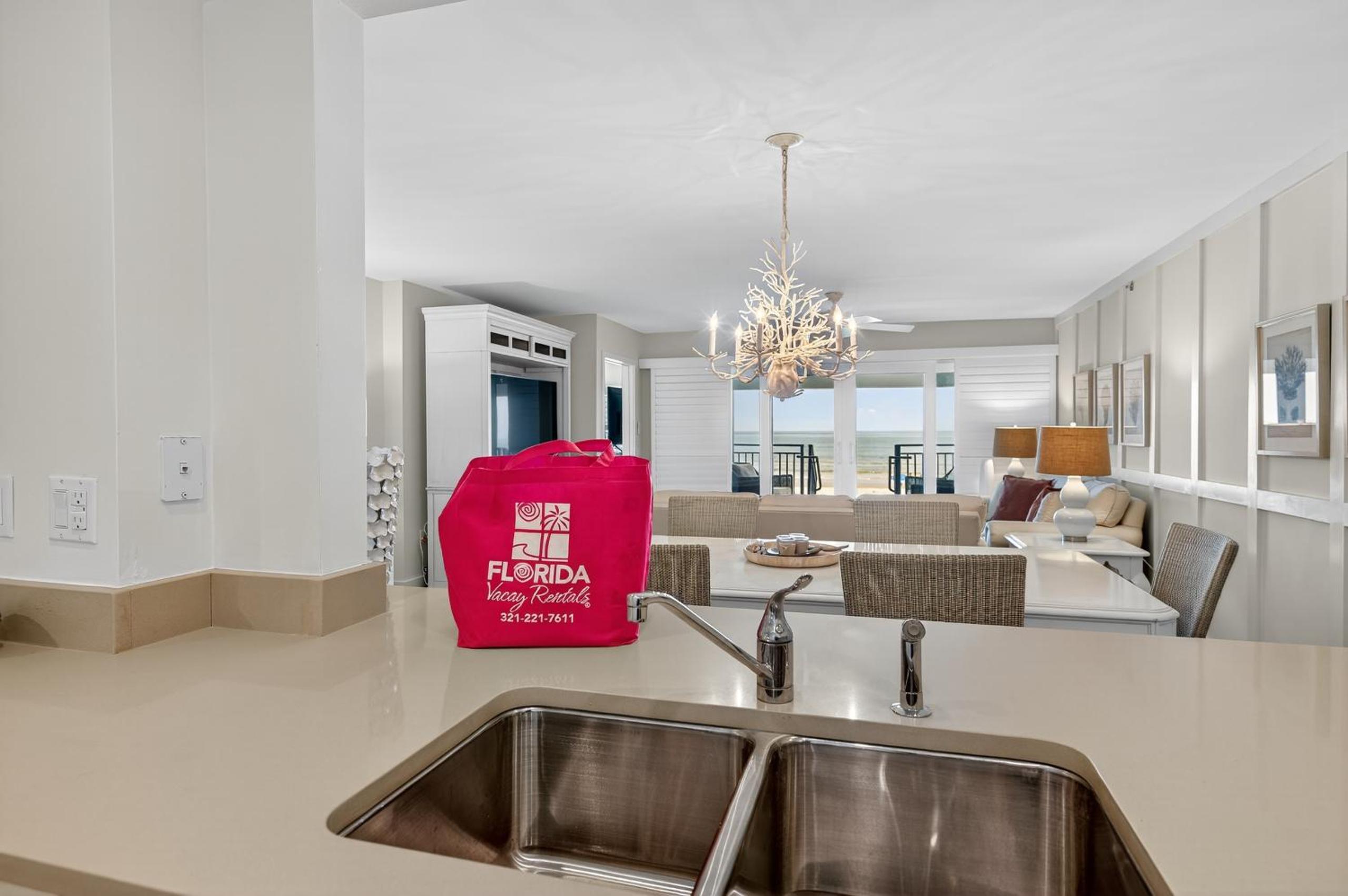 Ground floor direct oceanfront with a large patio, pool, and covered parking