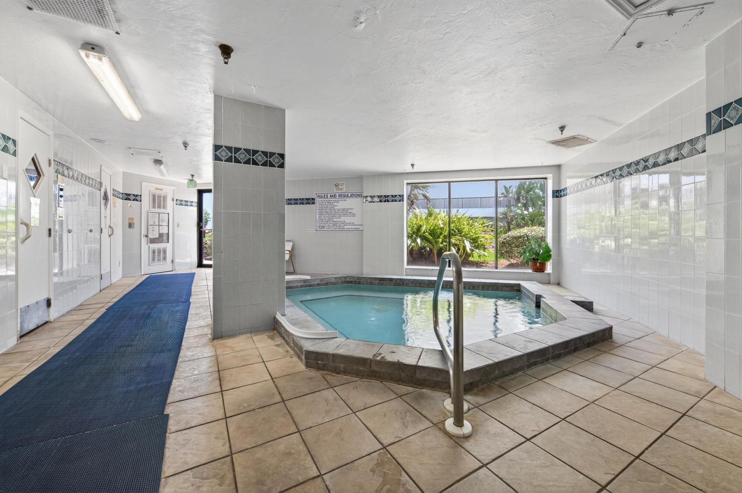 New Listing! Updated direct oceanfront condo with a pool, hot tub, and garage parking