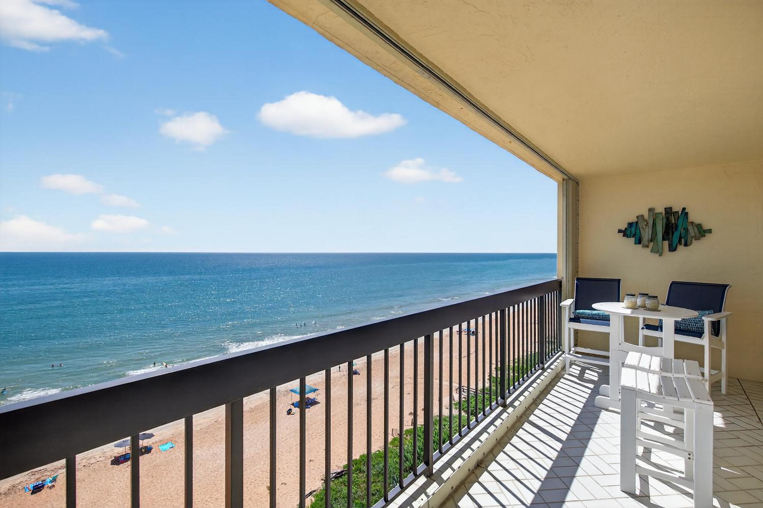 Renovated direct oceanfront condo with spacious balcony, heated pool, and garage parking