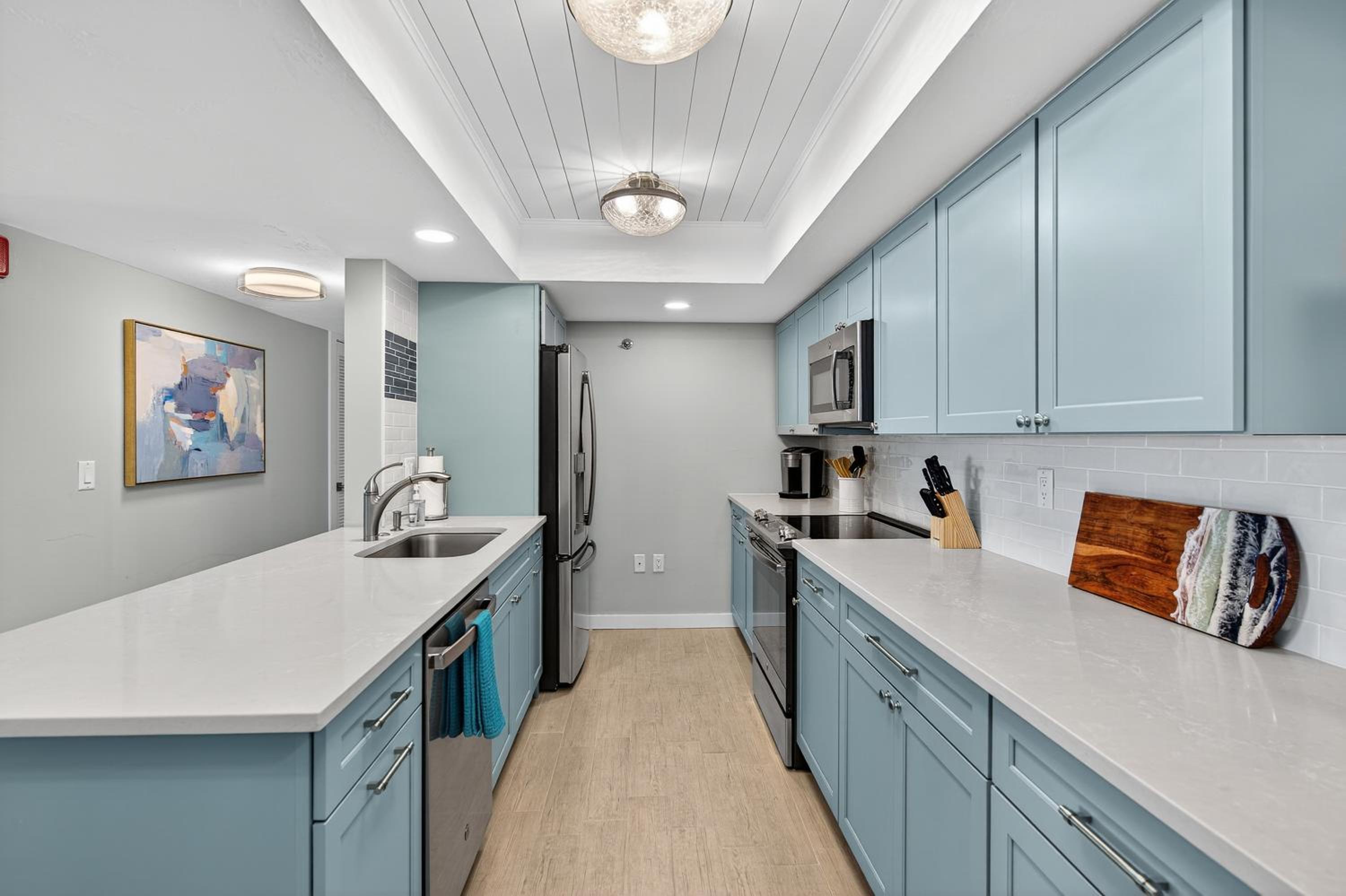 Renovated direct oceanfront condo with spacious balcony, heated pool, and garage parking