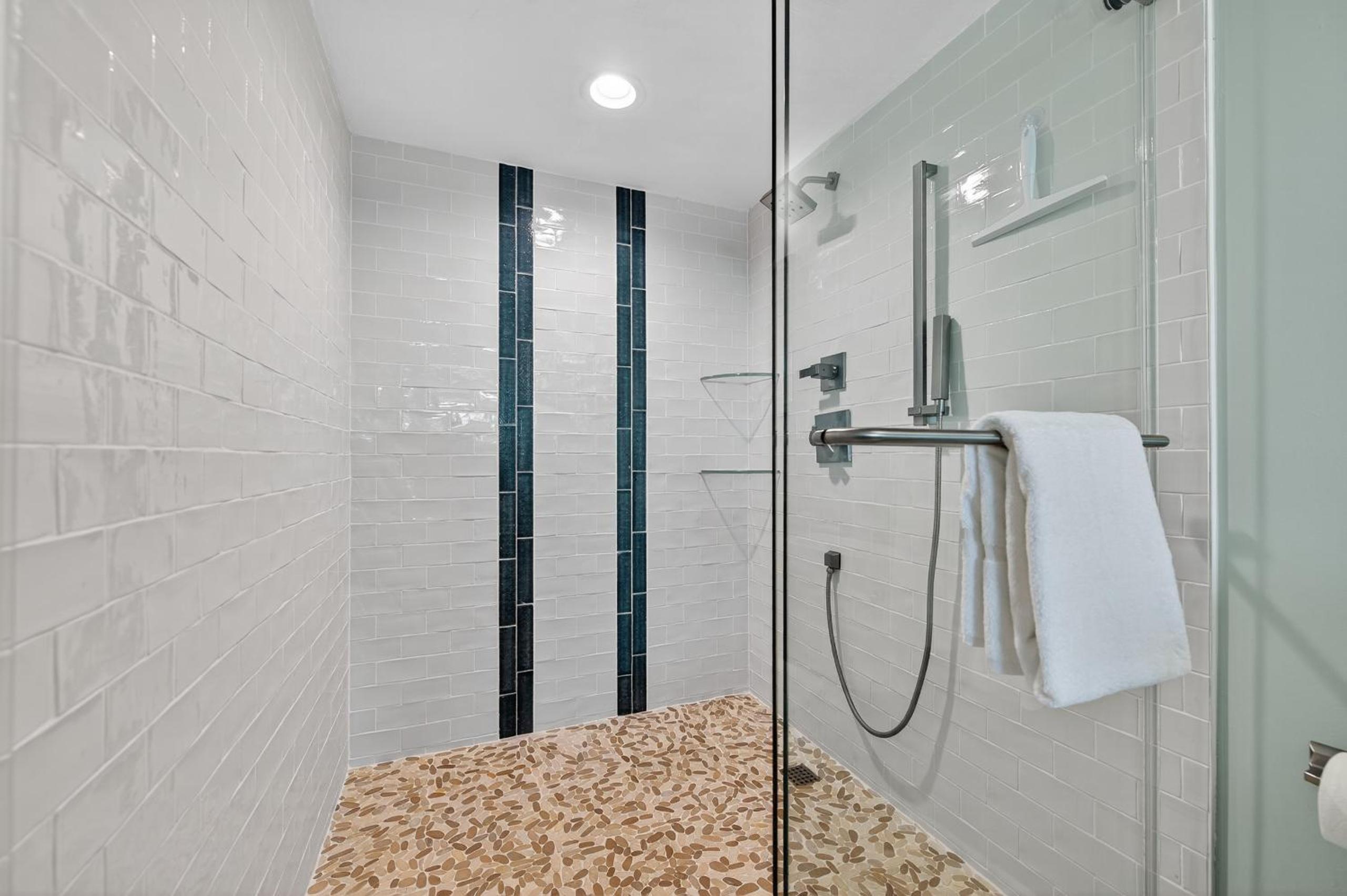 Renovated direct oceanfront condo with spacious balcony, heated pool, and garage parking