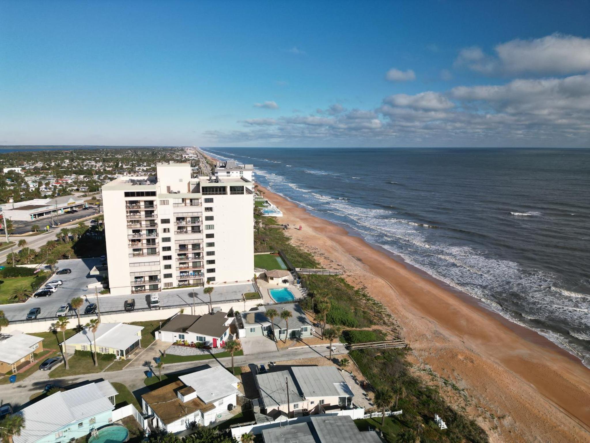 Renovated direct oceanfront condo with spacious balcony, heated pool, and garage parking