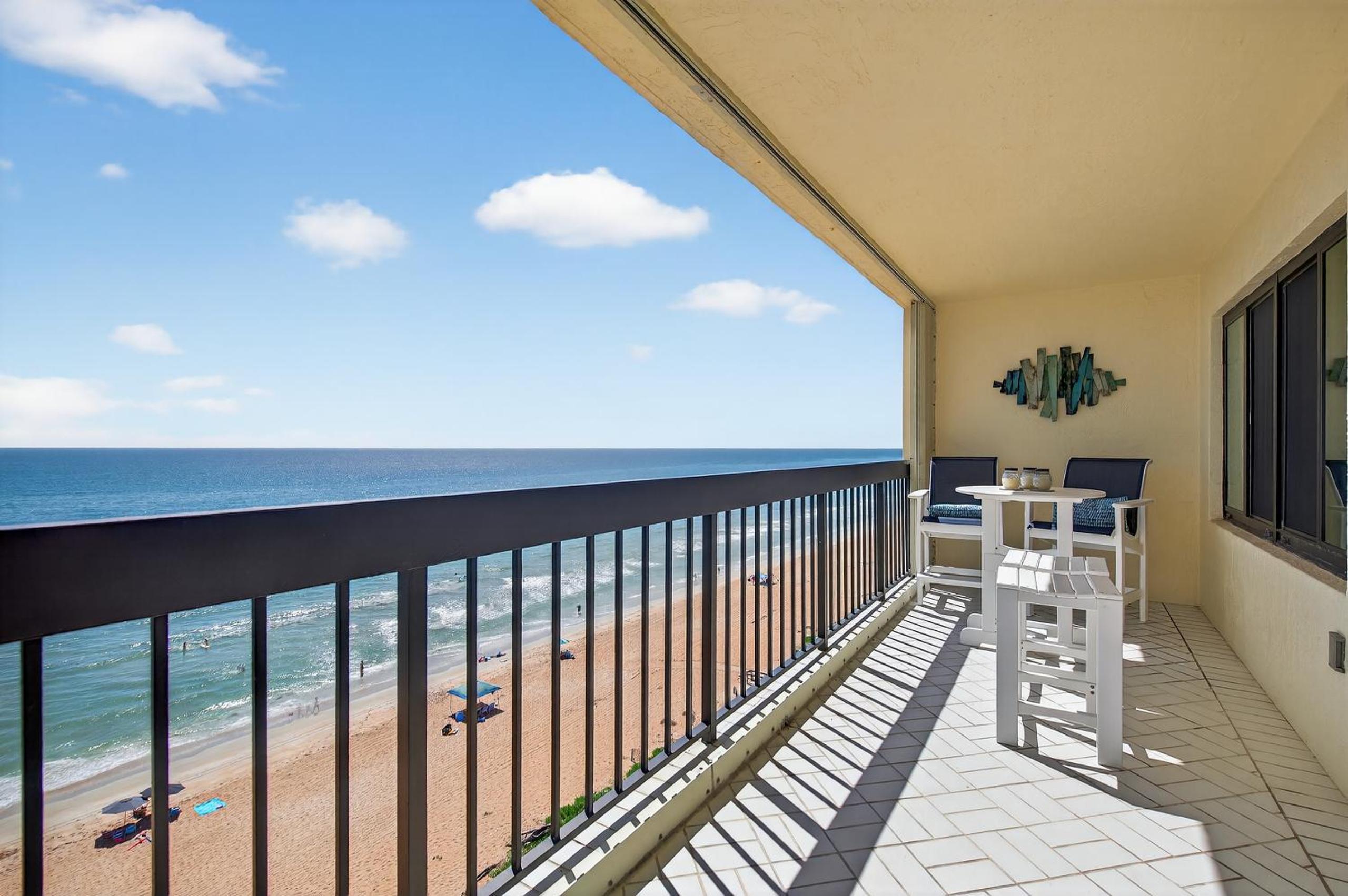 Renovated direct oceanfront condo with spacious balcony, heated pool, and garage parking