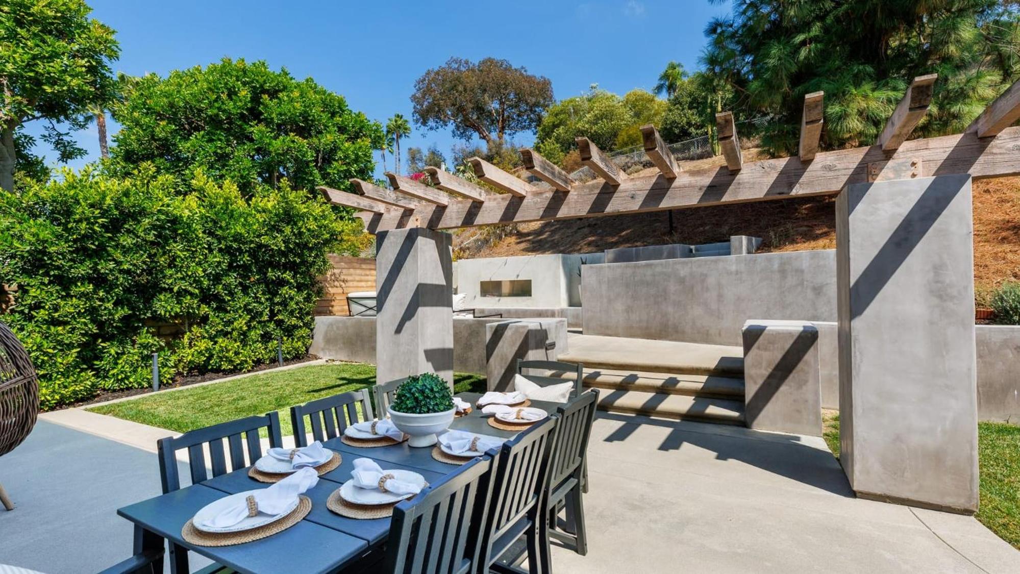 Spanish-Inspired Mission Viejo Home with Courtyard Firepit Backyard Dining Casa Cordero by AvantStay