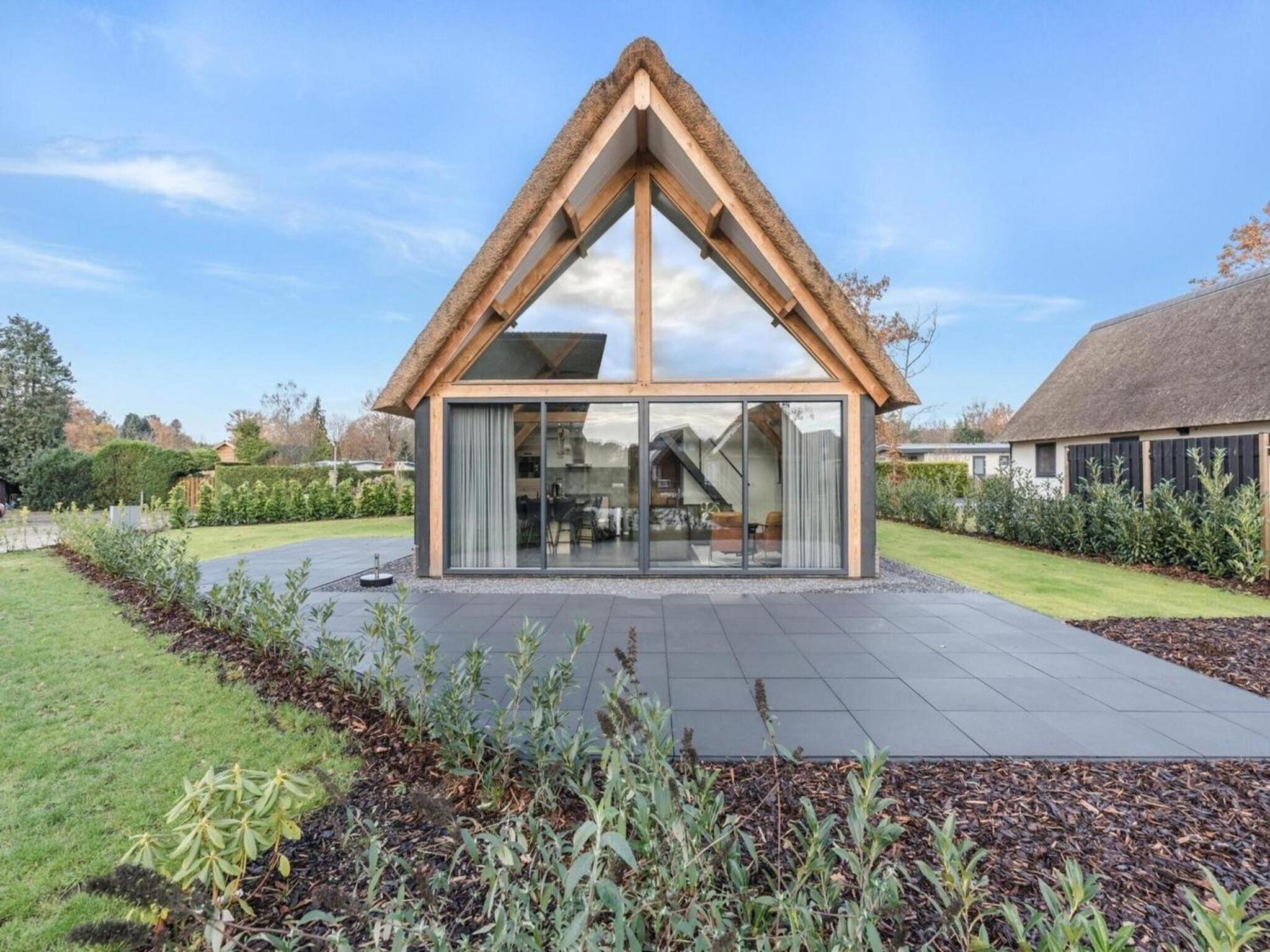 Modern bungalow in Baarle-Nassau with pond view