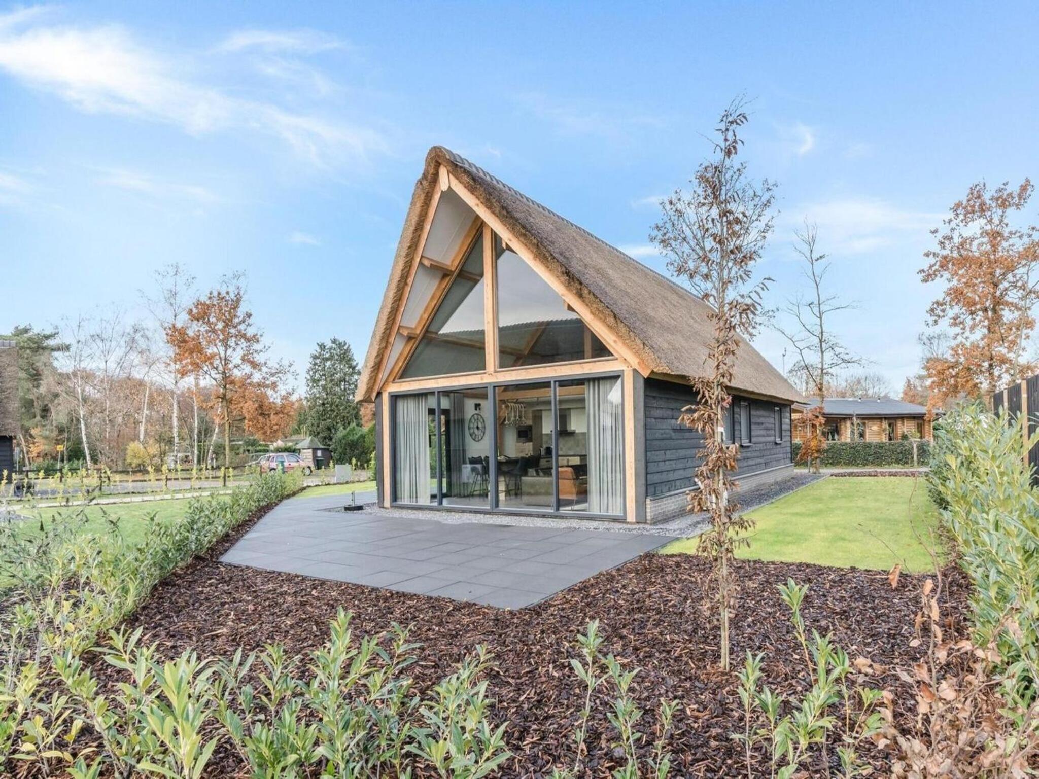 Modern bungalow in Baarle-Nassau with pond view