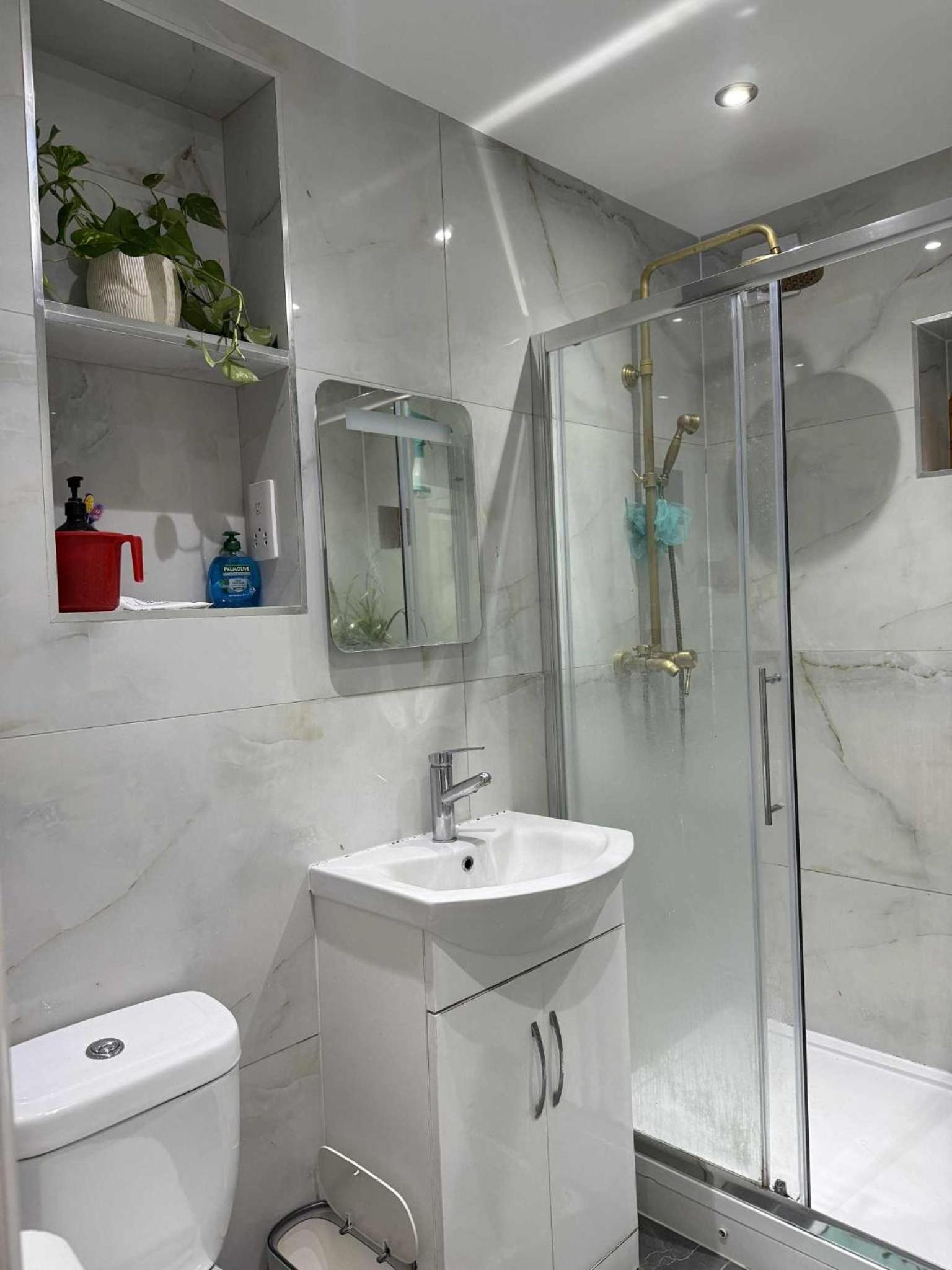 Private guest suite inside a family home with own entrance, kitchen, and bathroom