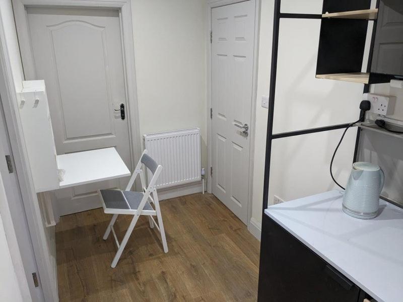 Private guest suite inside a family home with own entrance, kitchen, and bathroom