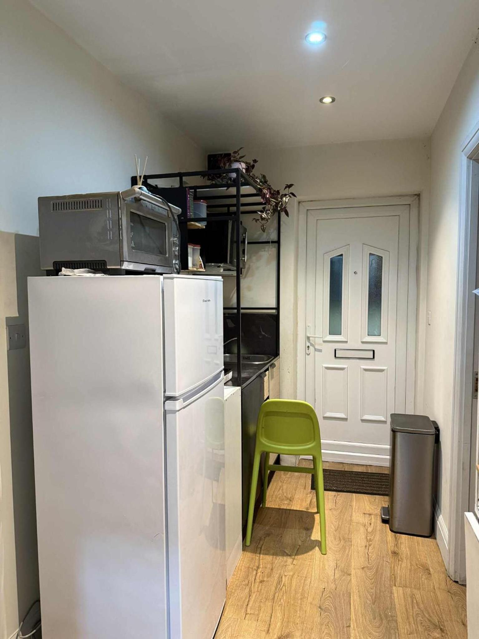 Private guest suite inside a family home with own entrance, kitchen, and bathroom