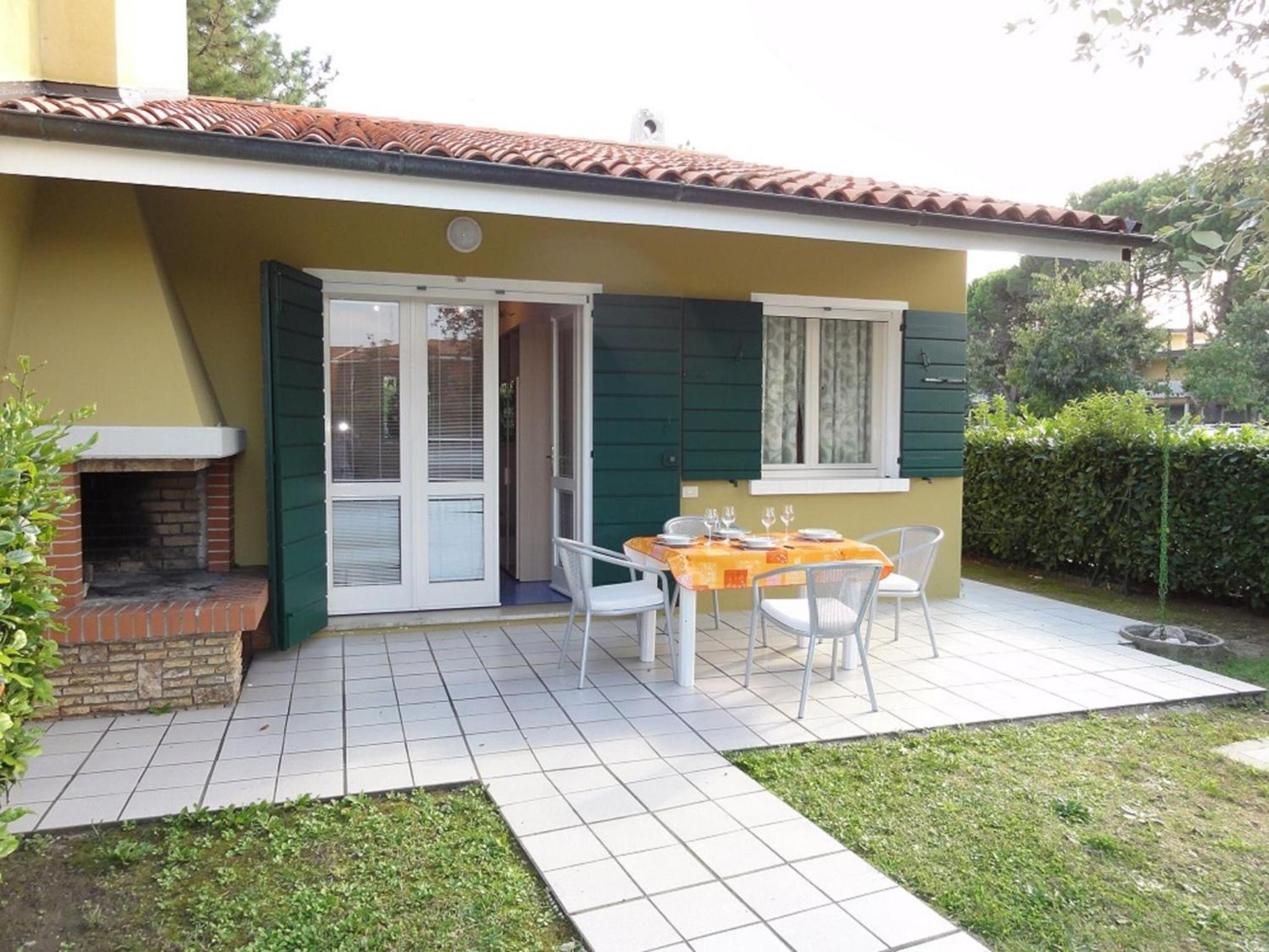 Villa with outdoor patio and fireplace