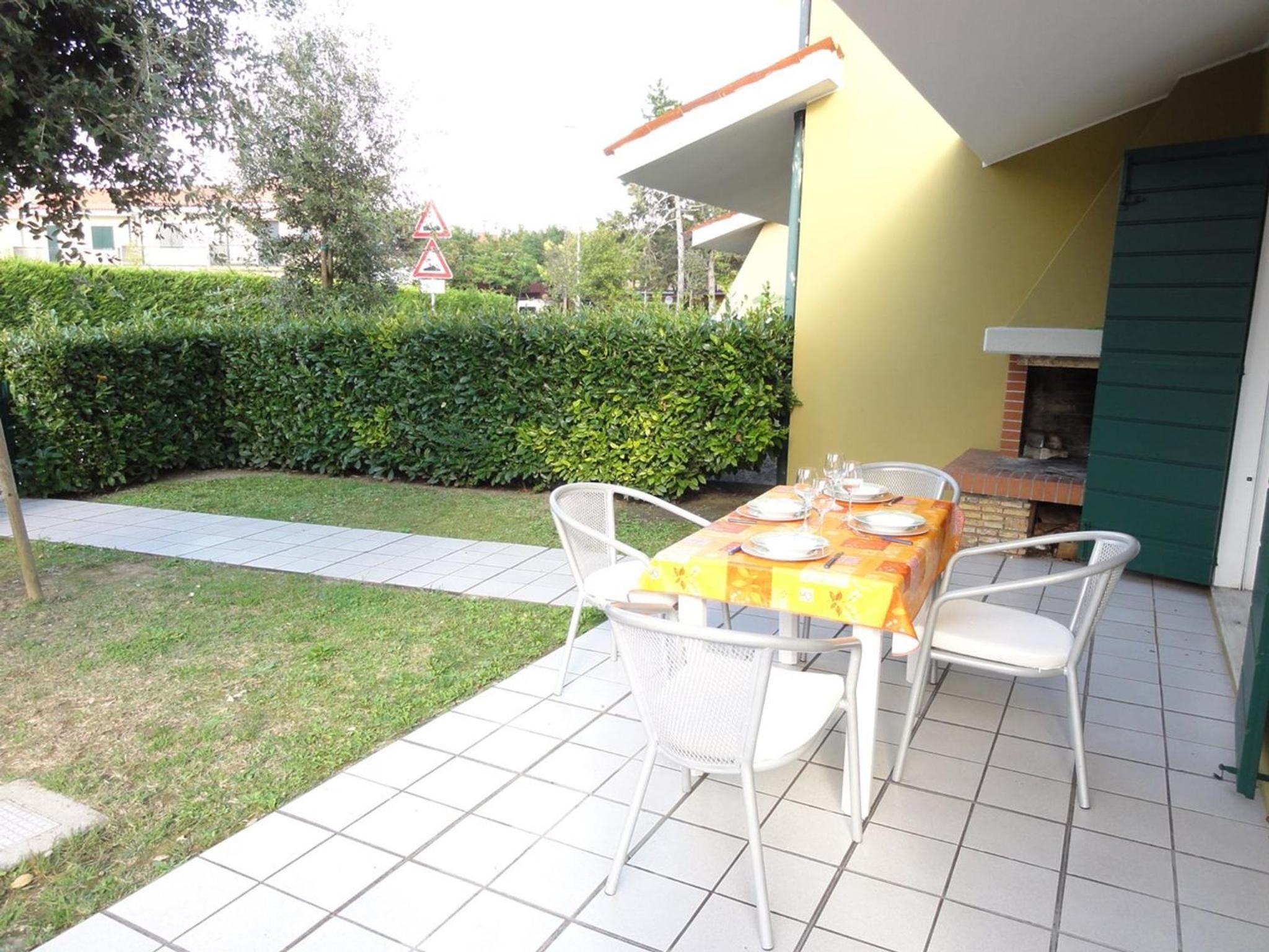 Villa with outdoor patio and fireplace