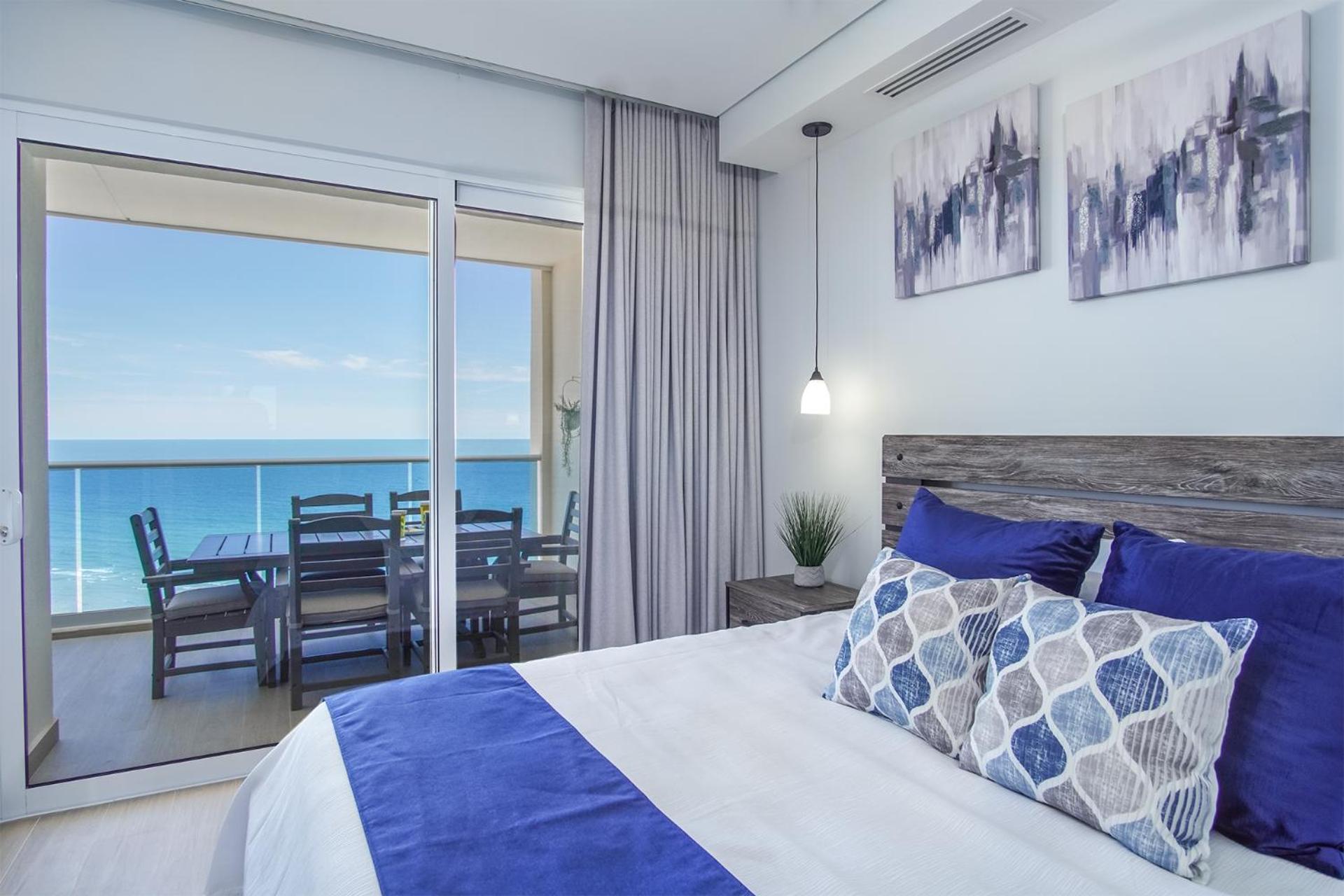 Relax in this modern ocean front condo Encantame E1404